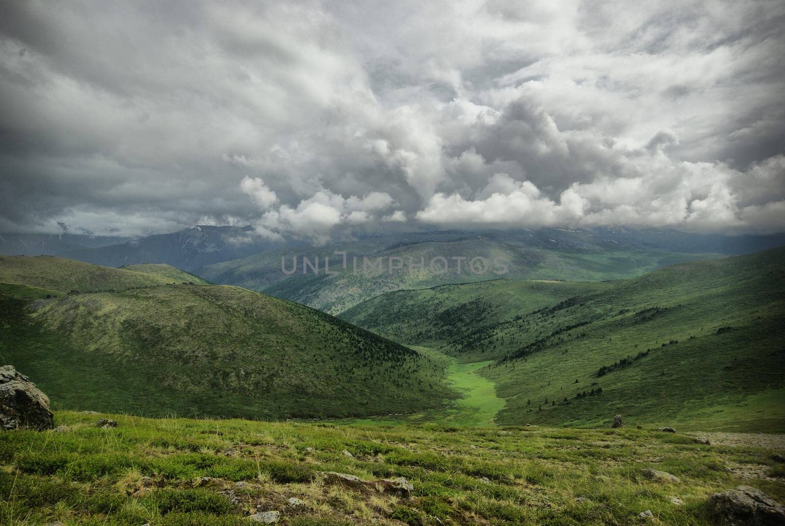 Mountain landscape. Highlands, the mountain peaks, gorges and valleys. The stones on the slopes.