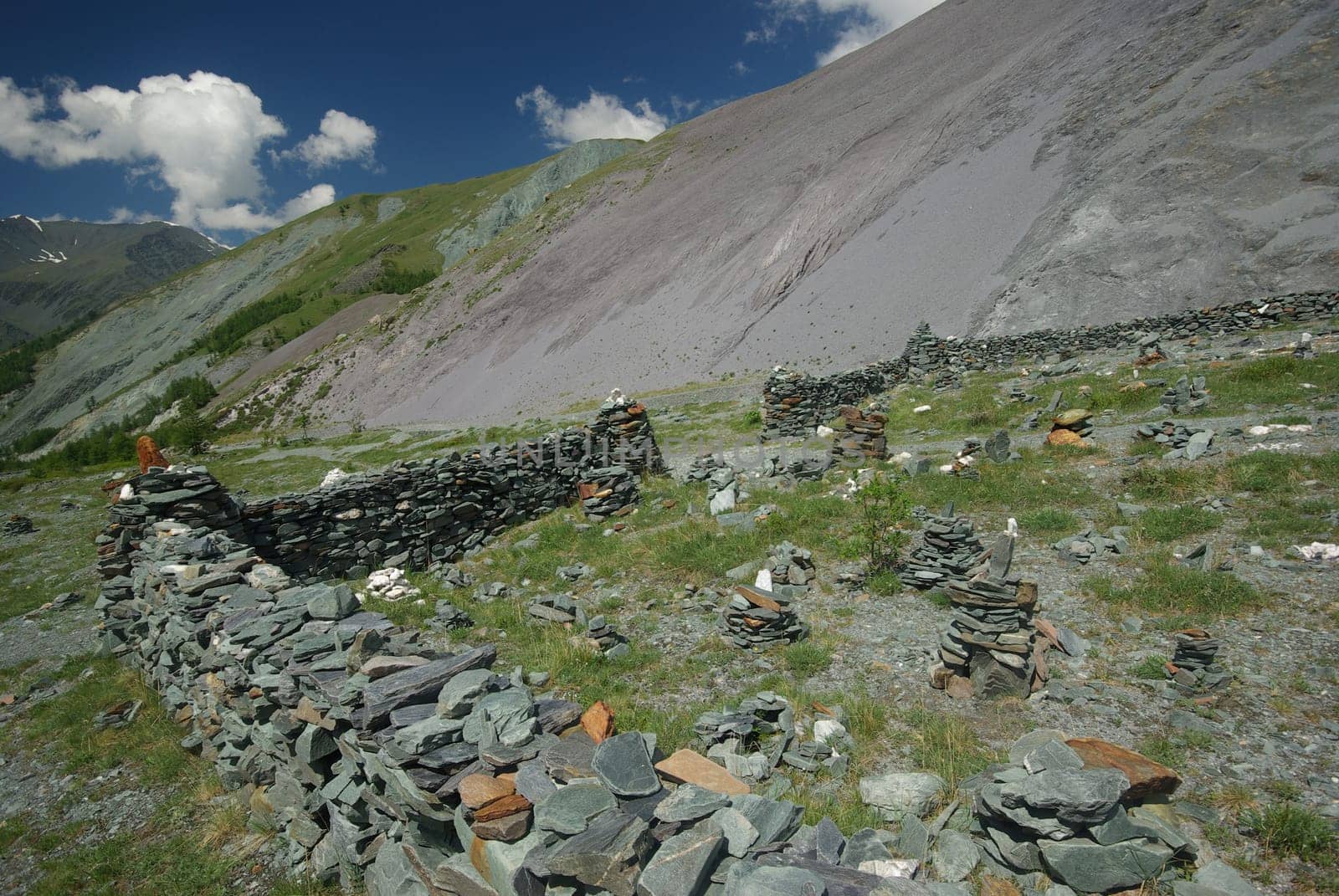 Mountain landscape. Highlands, the mountain peaks, gorges and valleys. The stones on the slopes.