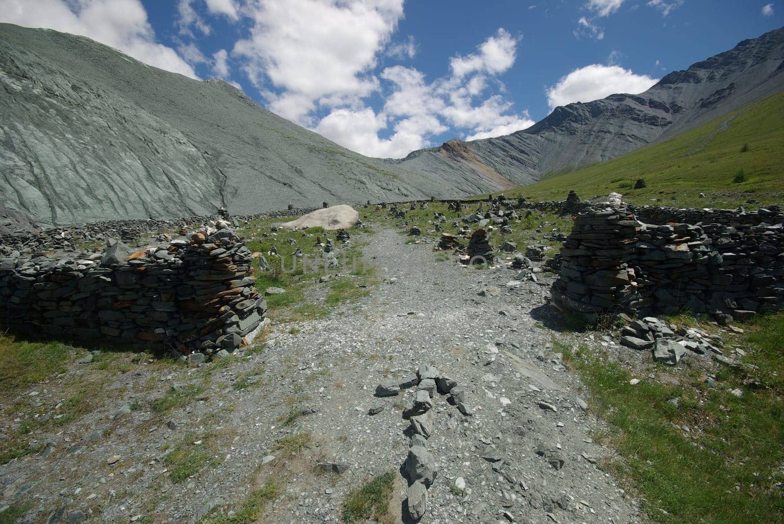 Mountain landscape. Highlands, the mountain peaks, gorges and valleys. The stones on the slopes.