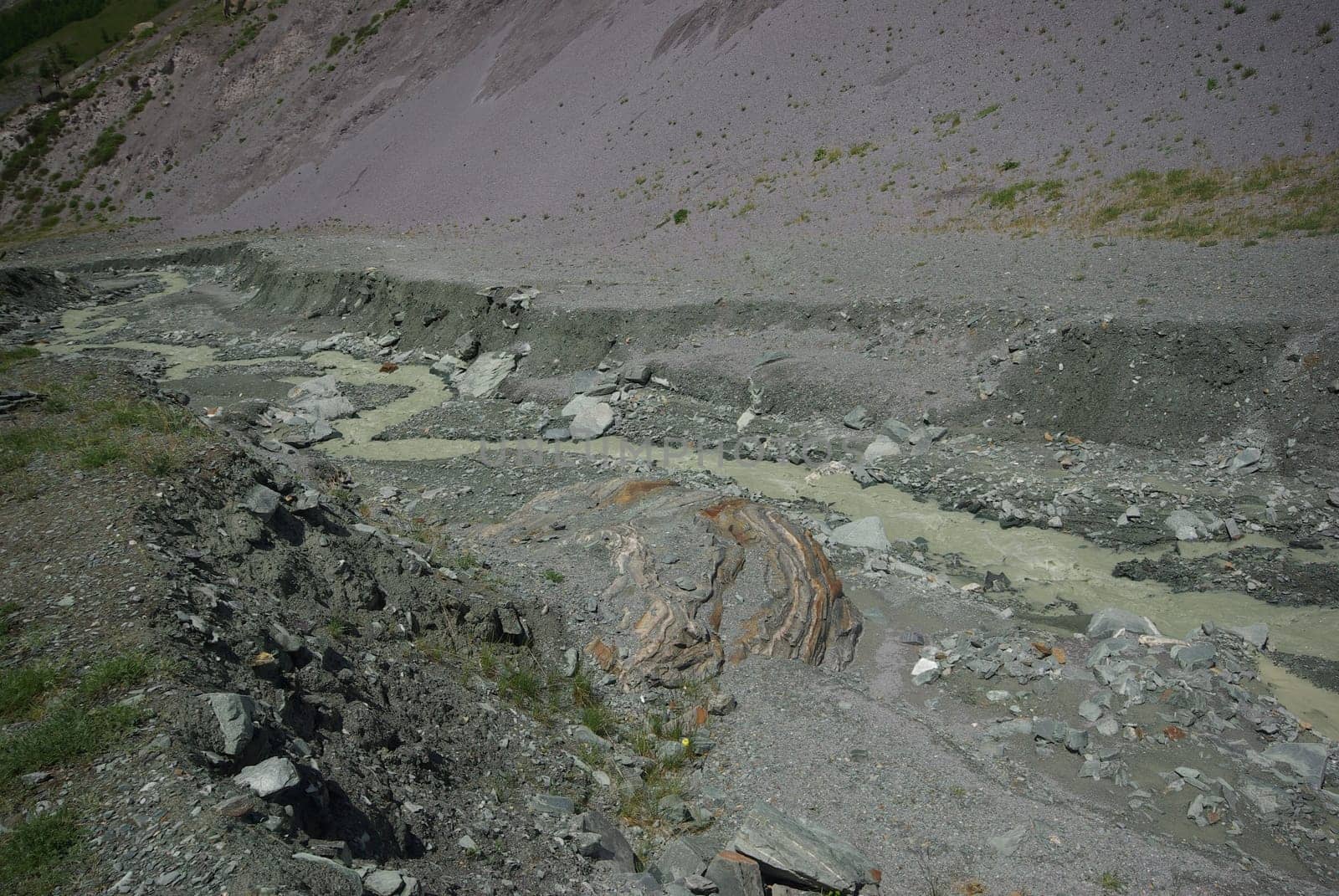 Mountain landscape. Highlands, the mountain peaks, gorges and valleys. The stones on the slopes.