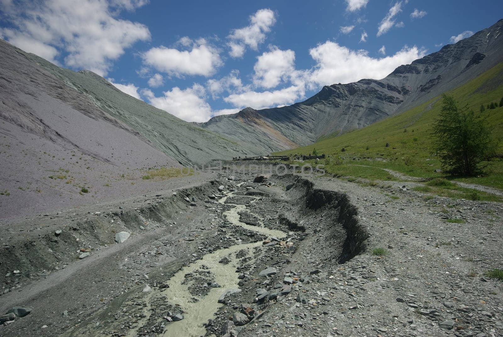 Mountain landscape. Highlands, the mountain peaks, gorges and valleys. The stones on the slopes.
