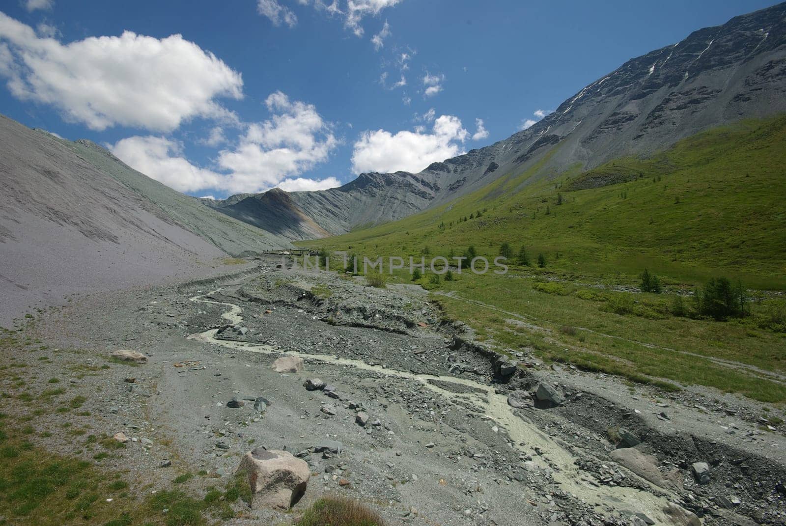 Mountain landscape. Highlands, the mountain peaks, gorges and valleys. The stones on the slopes.