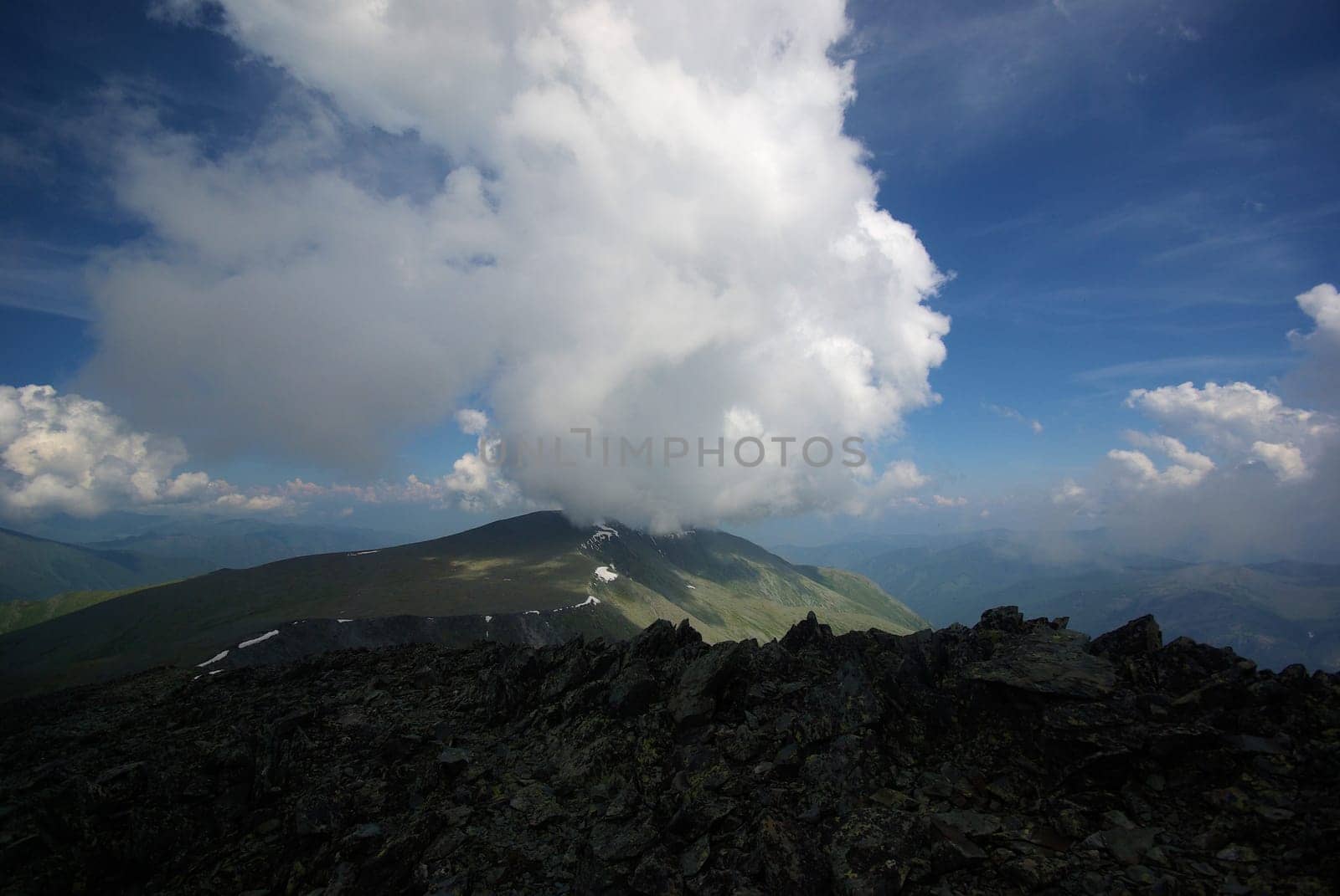 Mountain landscape. Highlands, the mountain peaks, gorges and valleys. The stones on the slopes.