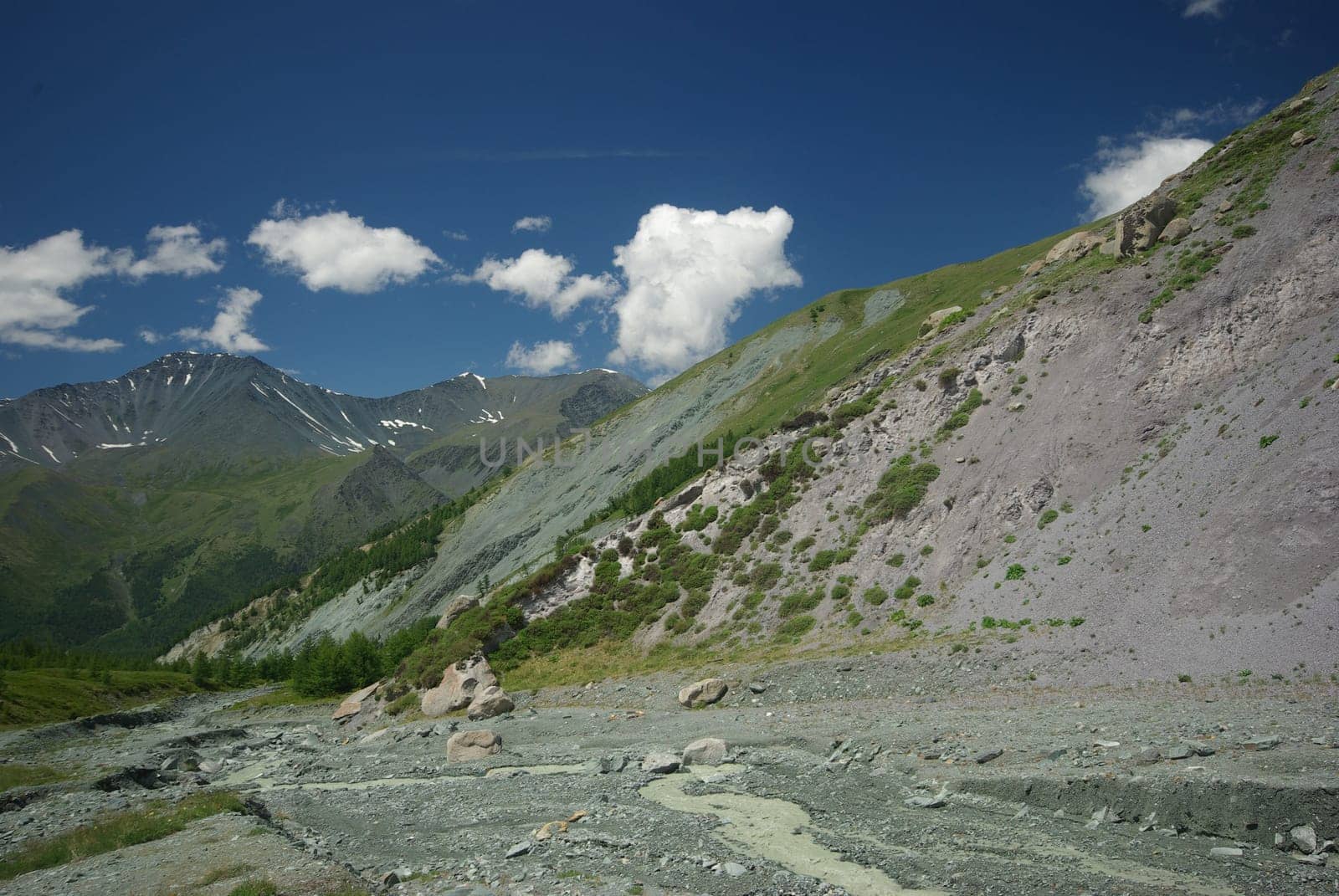 Mountain landscape. Highlands, the mountain peaks, gorges and valleys. The stones on the slopes.