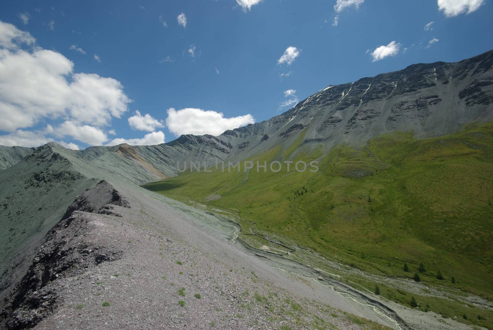 Mountain landscape. Highlands, the mountain peaks, gorges and valleys. The stones on the slopes.
