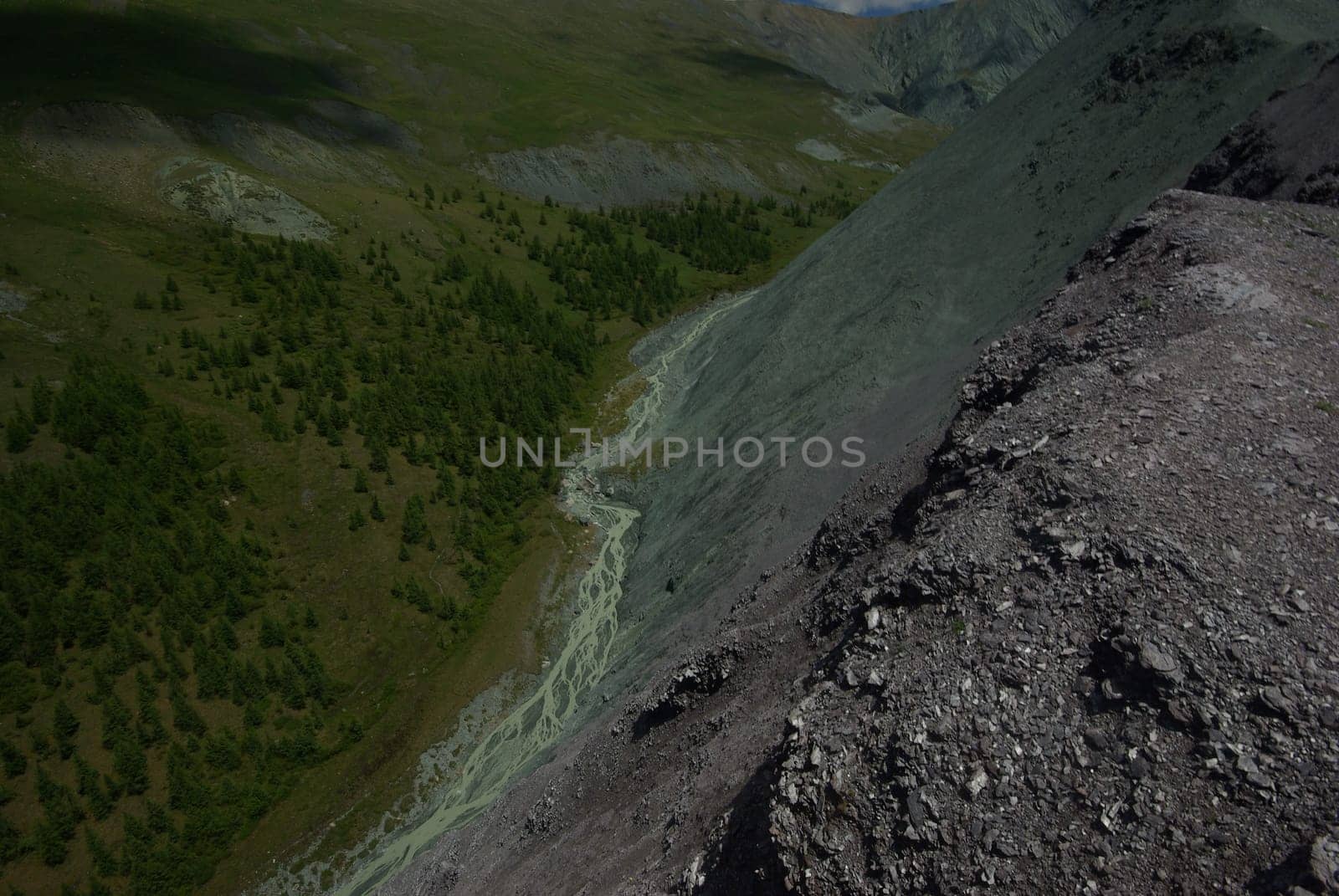 Mountain landscape. Highlands, the mountain peaks, gorges and valleys. The stones on the slopes.