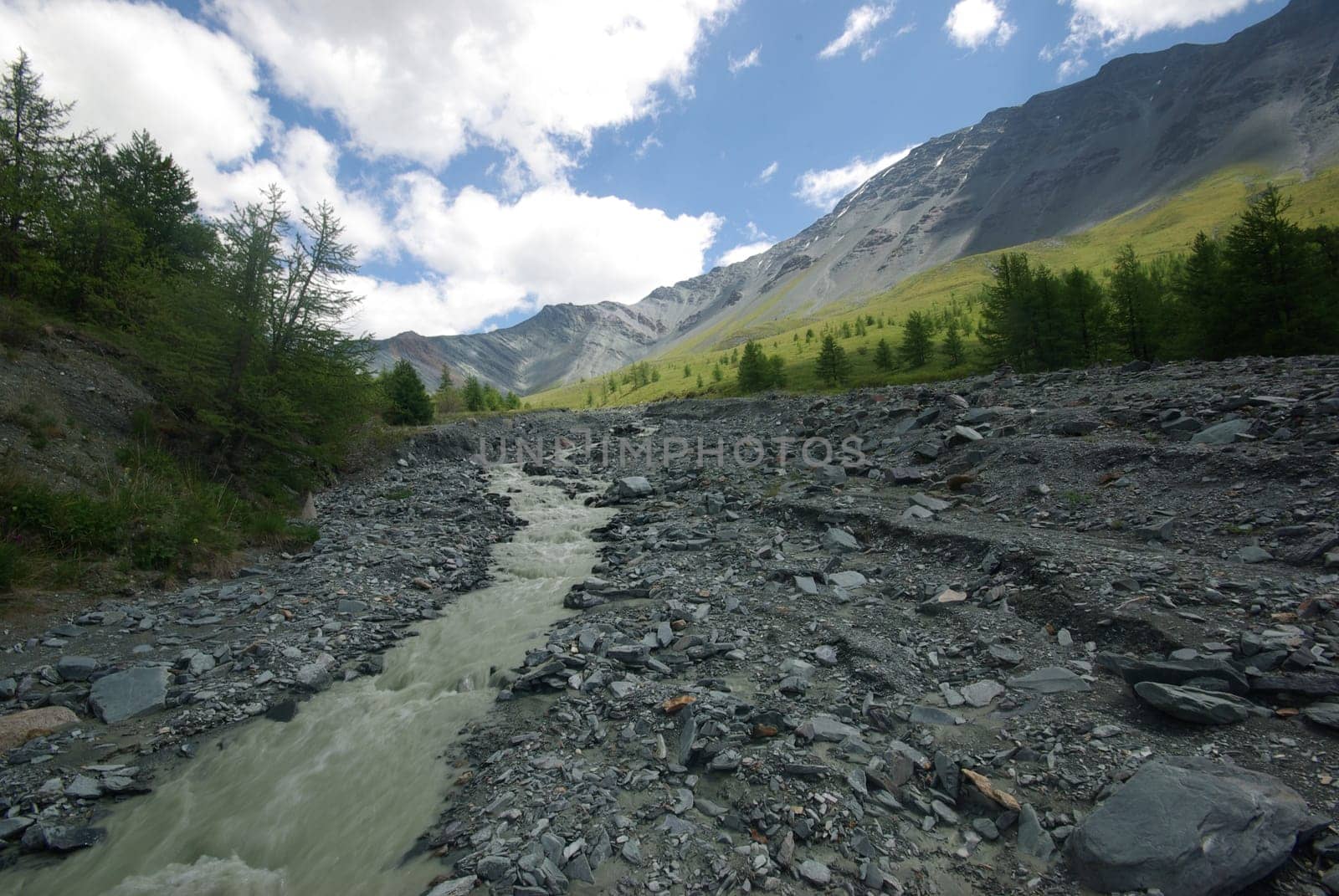 Mountain landscape. Highlands, the mountain peaks, gorges and valleys. The stones on the slopes.
