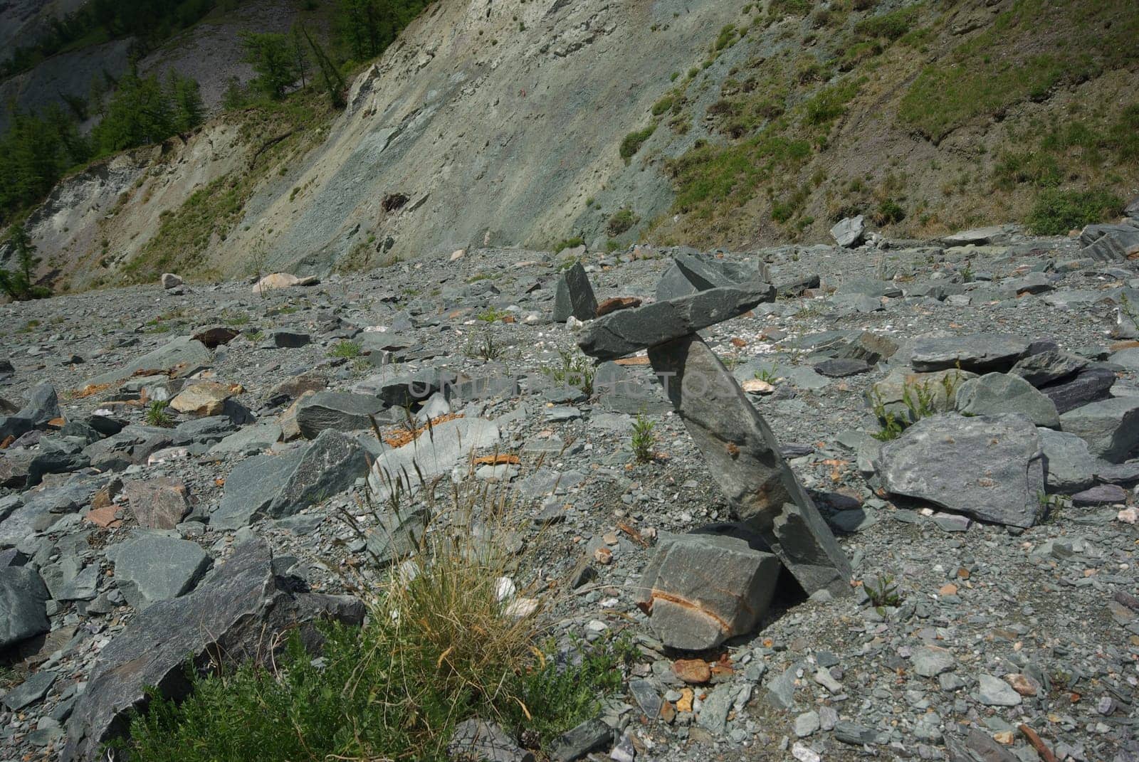 Mountain landscape. Highlands, the mountain peaks, gorges and valleys. The stones on the slopes.