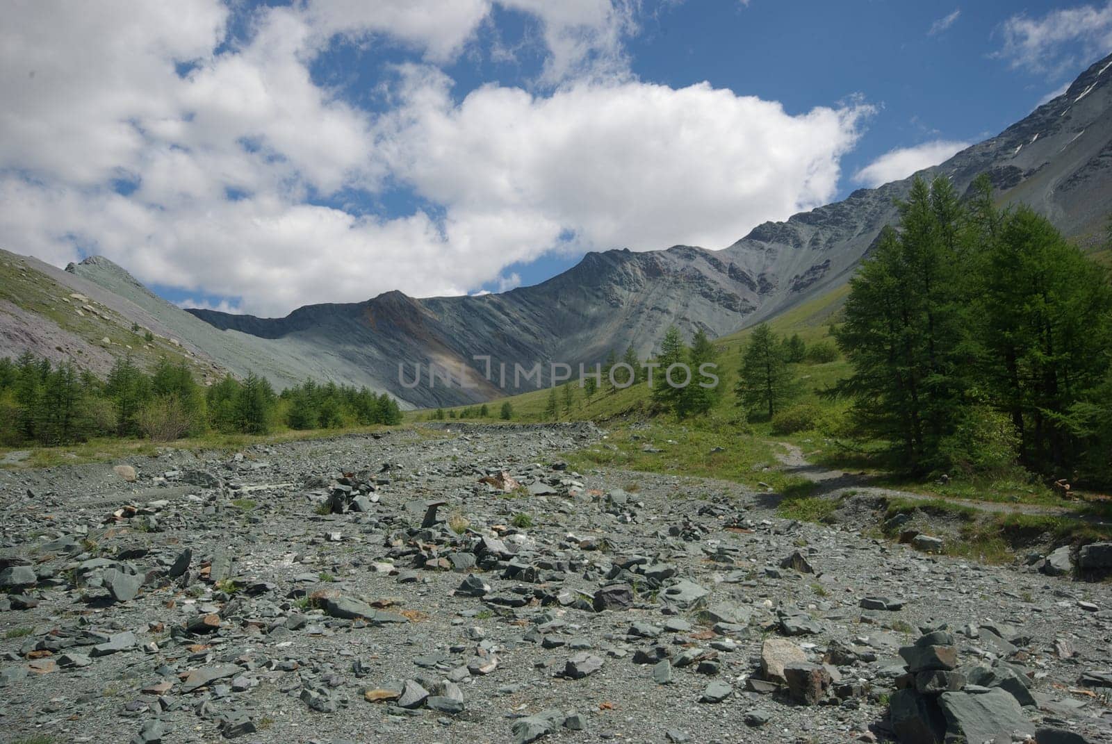 Mountain landscape. Highlands, the mountain peaks, gorges and valleys. The stones on the slopes.
