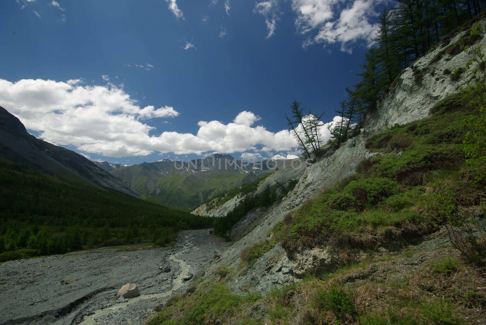 Mountain landscape. Highlands, the mountain peaks, gorges and valleys. The stones on the slopes.