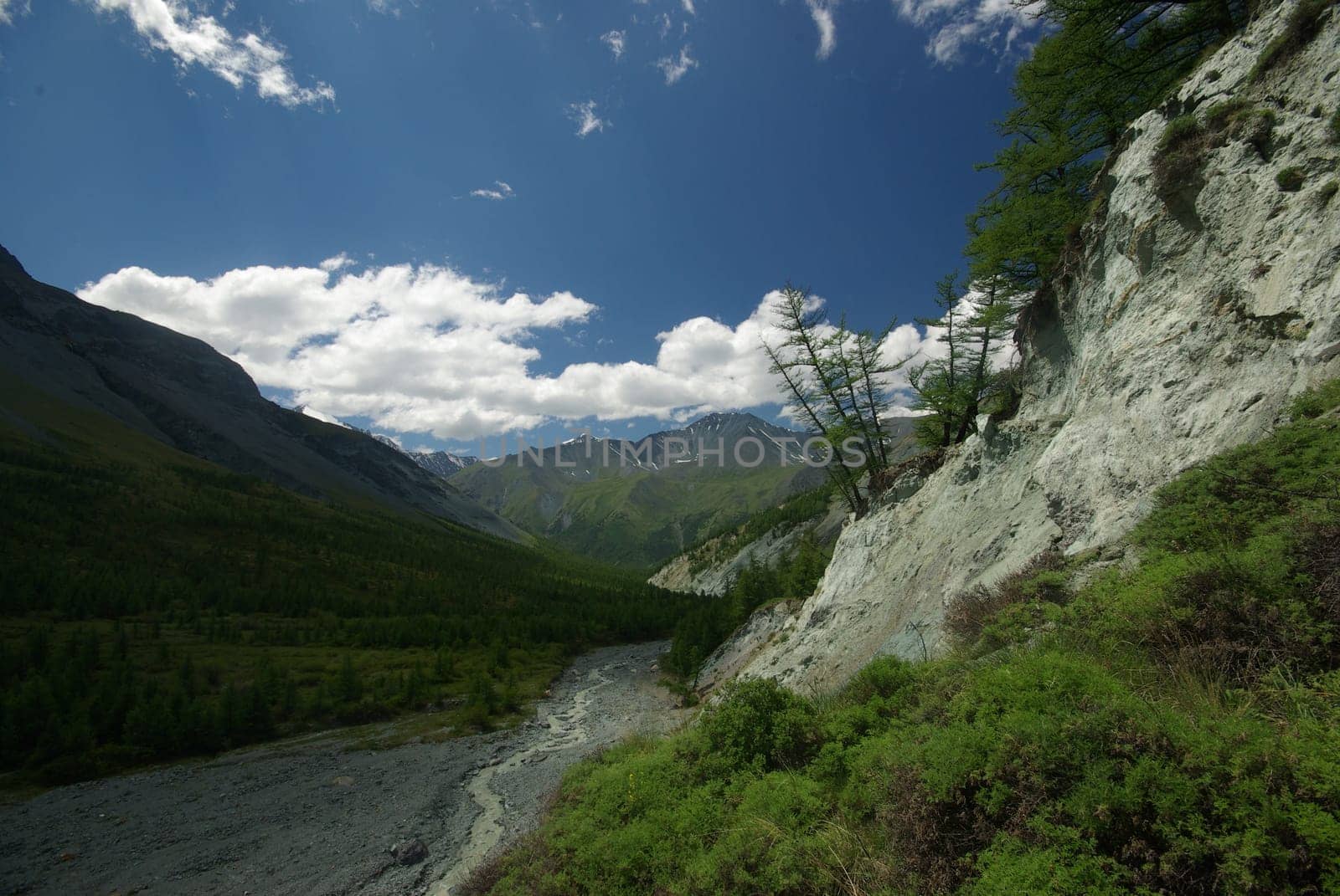 Mountain landscape. Highlands, the mountain peaks, gorges and valleys. The stones on the slopes.