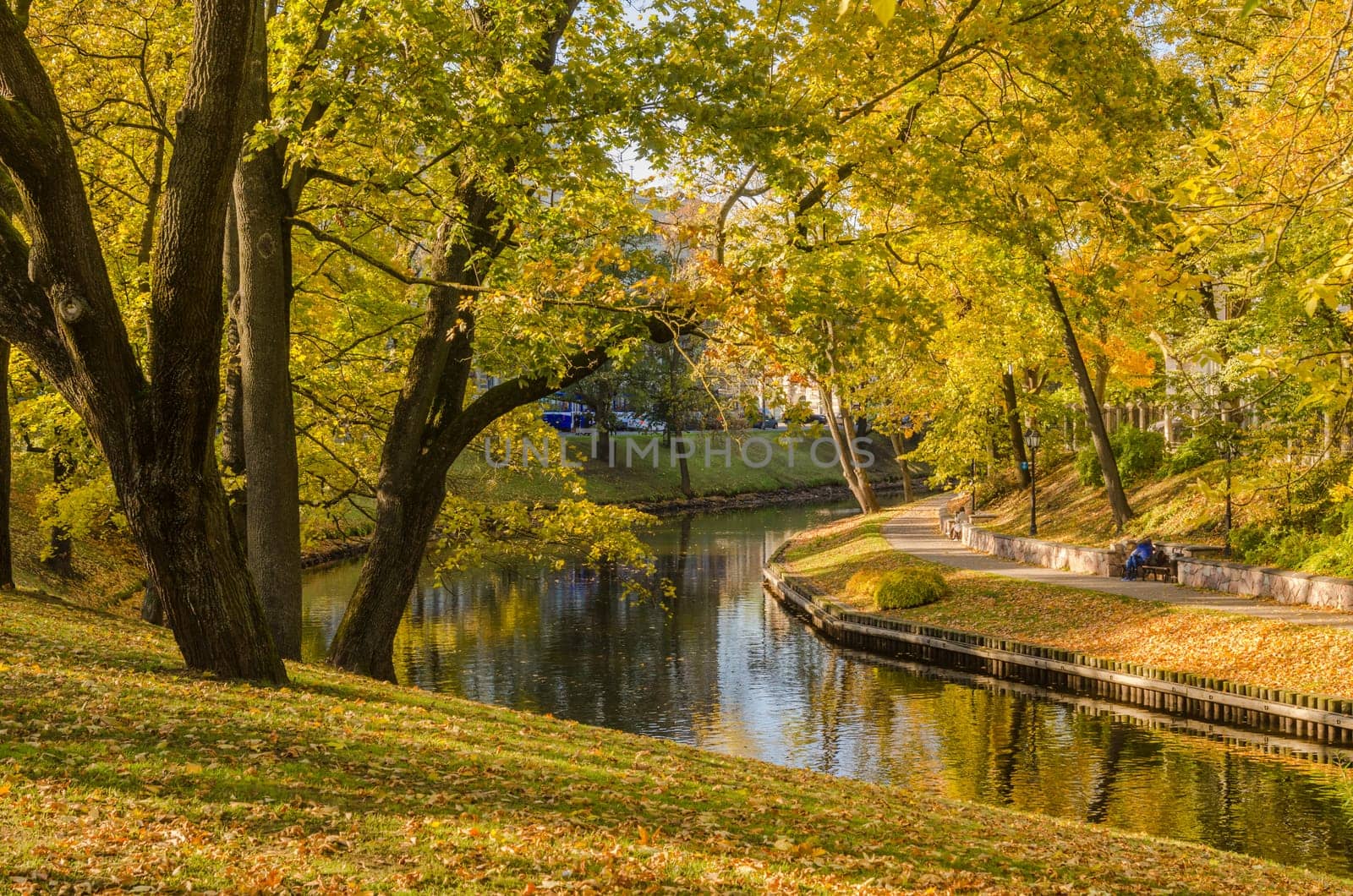 Beautiful autumn park at the channel in Riga