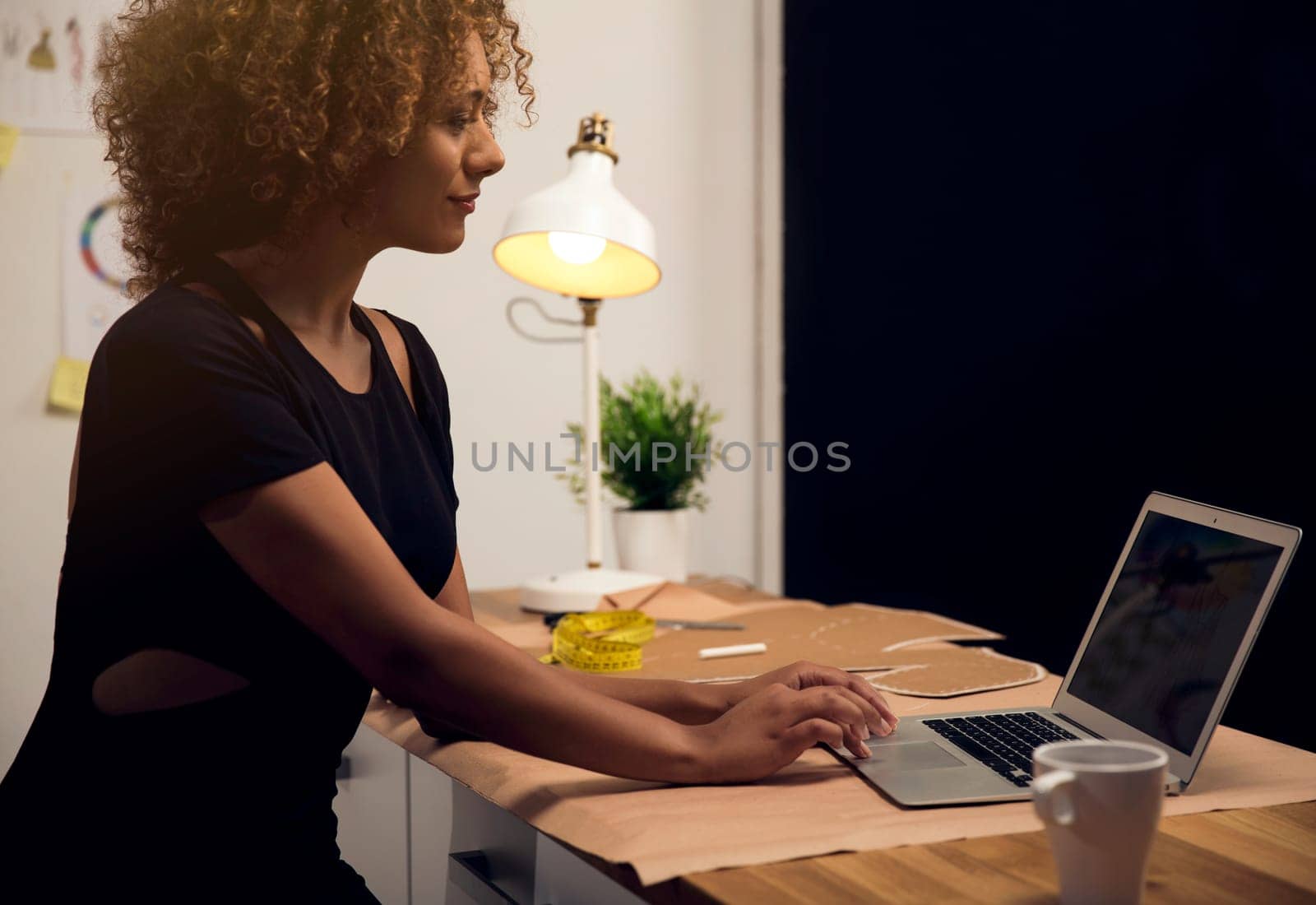 Two young entrepreneur women, and fashion designer working on her atelier