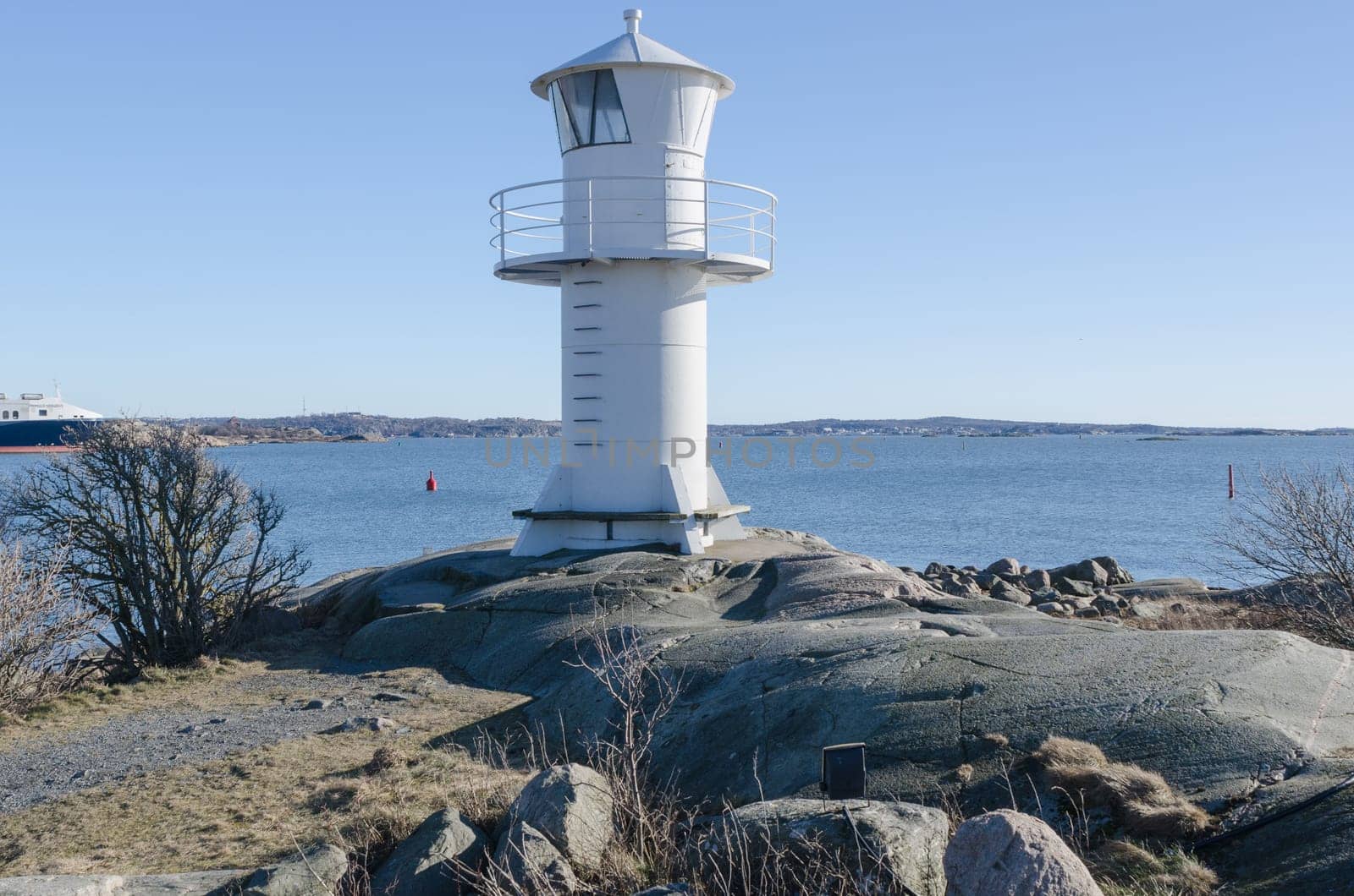 one lighthouse on sweden west-coast standing on a cliff