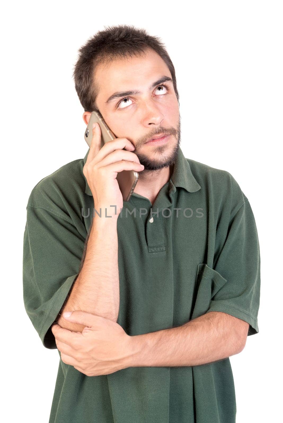 Angry young man with cellphone doing funny faces isolated in white
