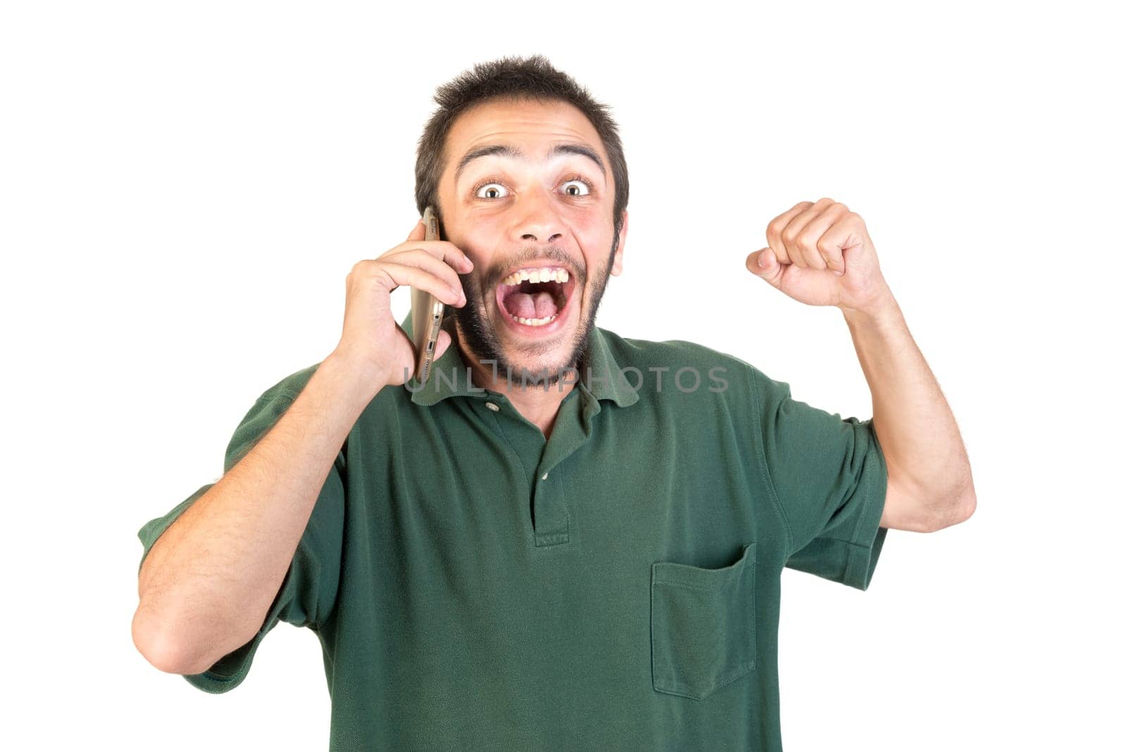 young man with cellphone doing funny faces isolated in white