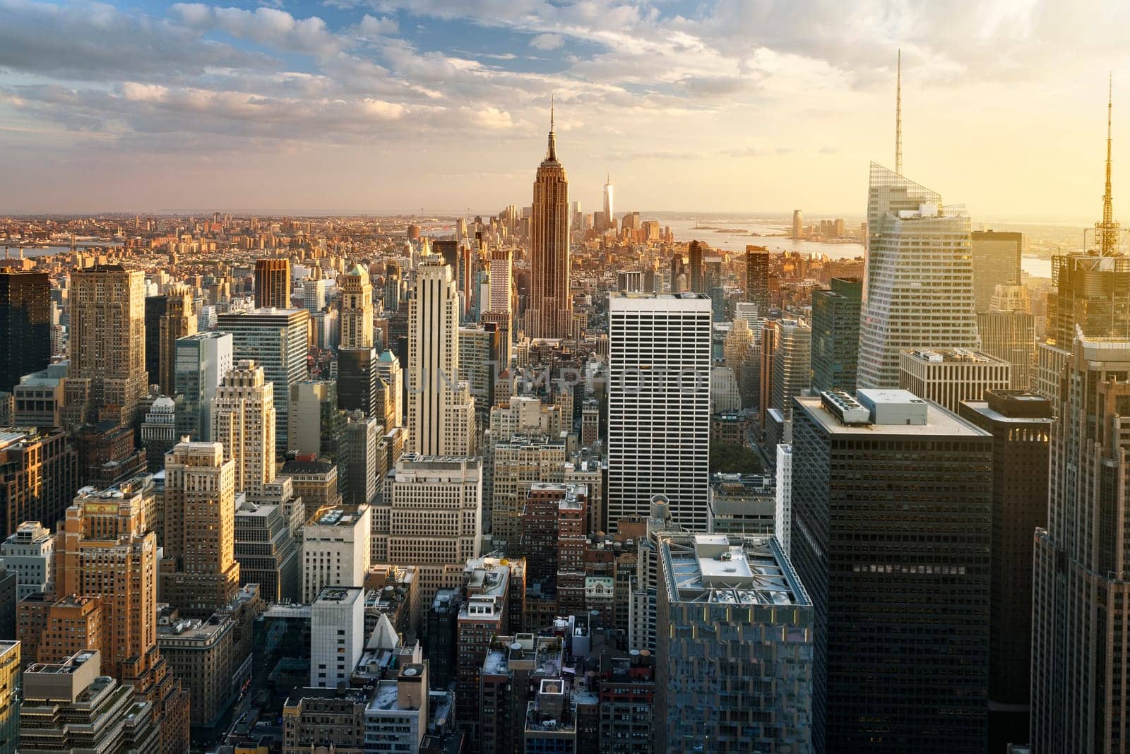 New York City skyline with urban skyscrapers at sunset, USA.