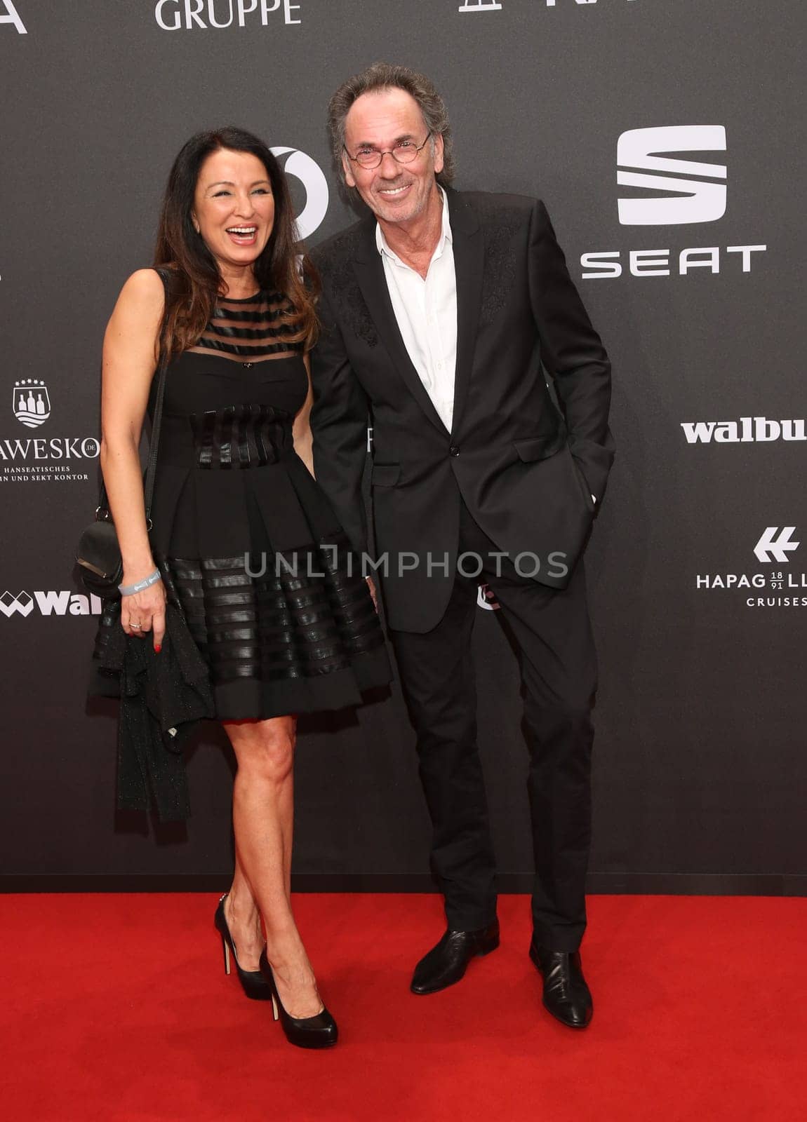 Hugo Egon Balder with girlfriend Elena.Presentation of the GOLDEN CAMERA 2017 at Messe Hamburg