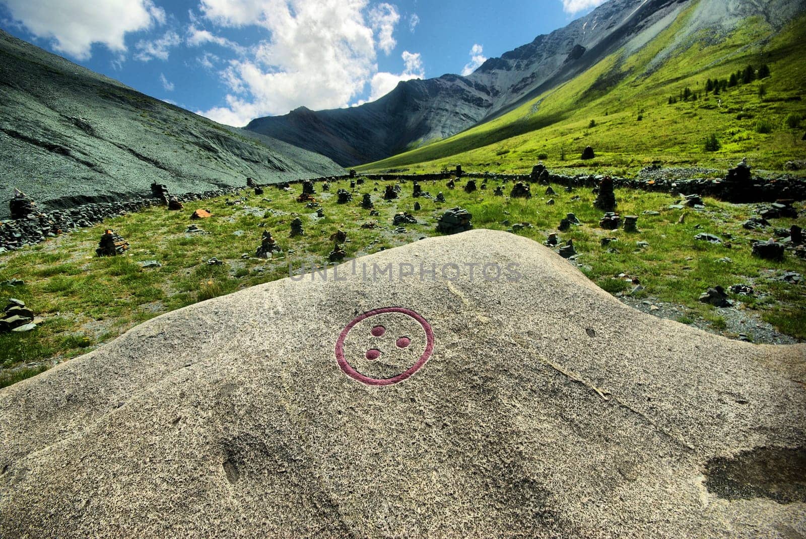 The mountain river in the mountains. Current through the gorge the river. Stones and rocky land near the river. Beautiful mountain landscape.