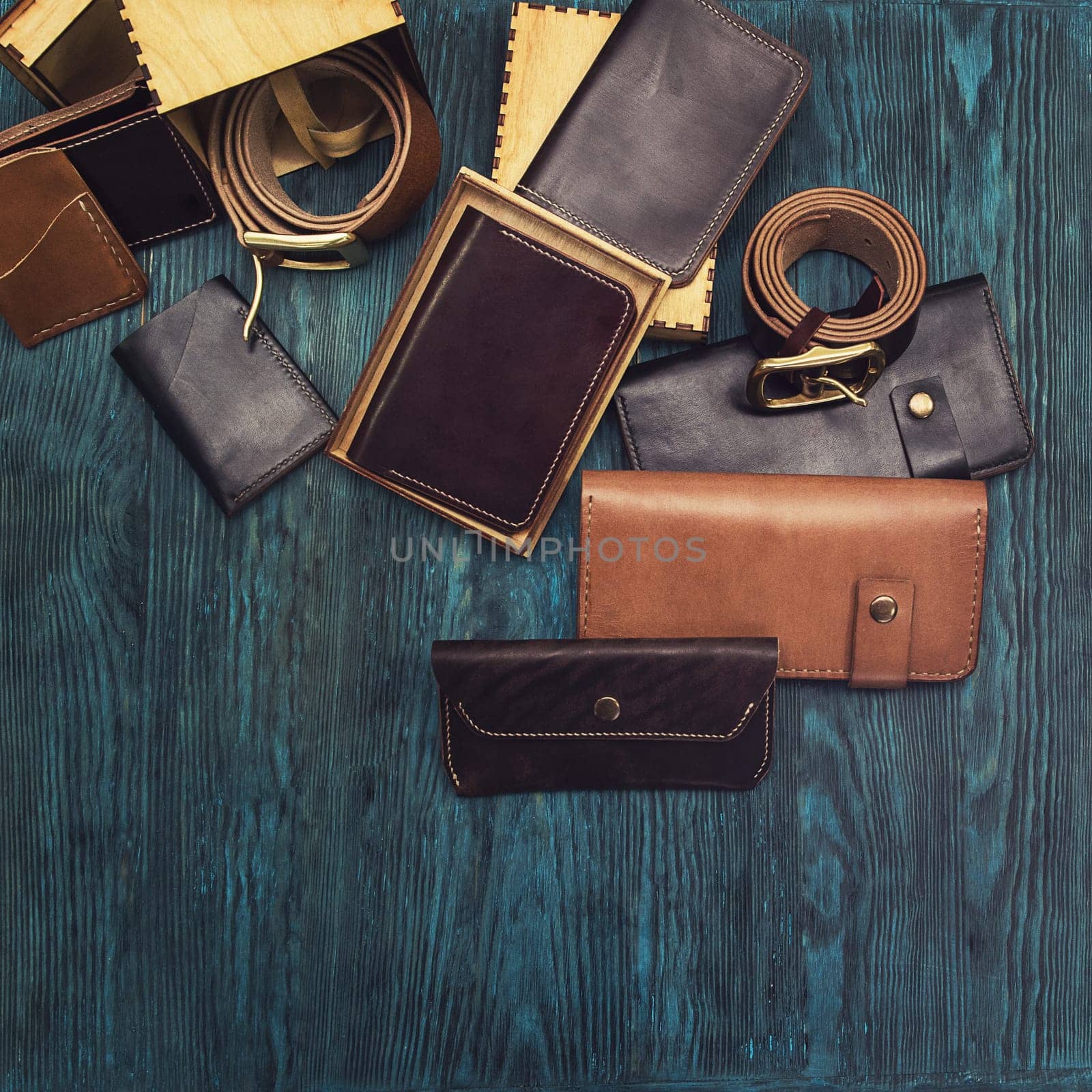 Men's accessories on a blue wooden background, top view