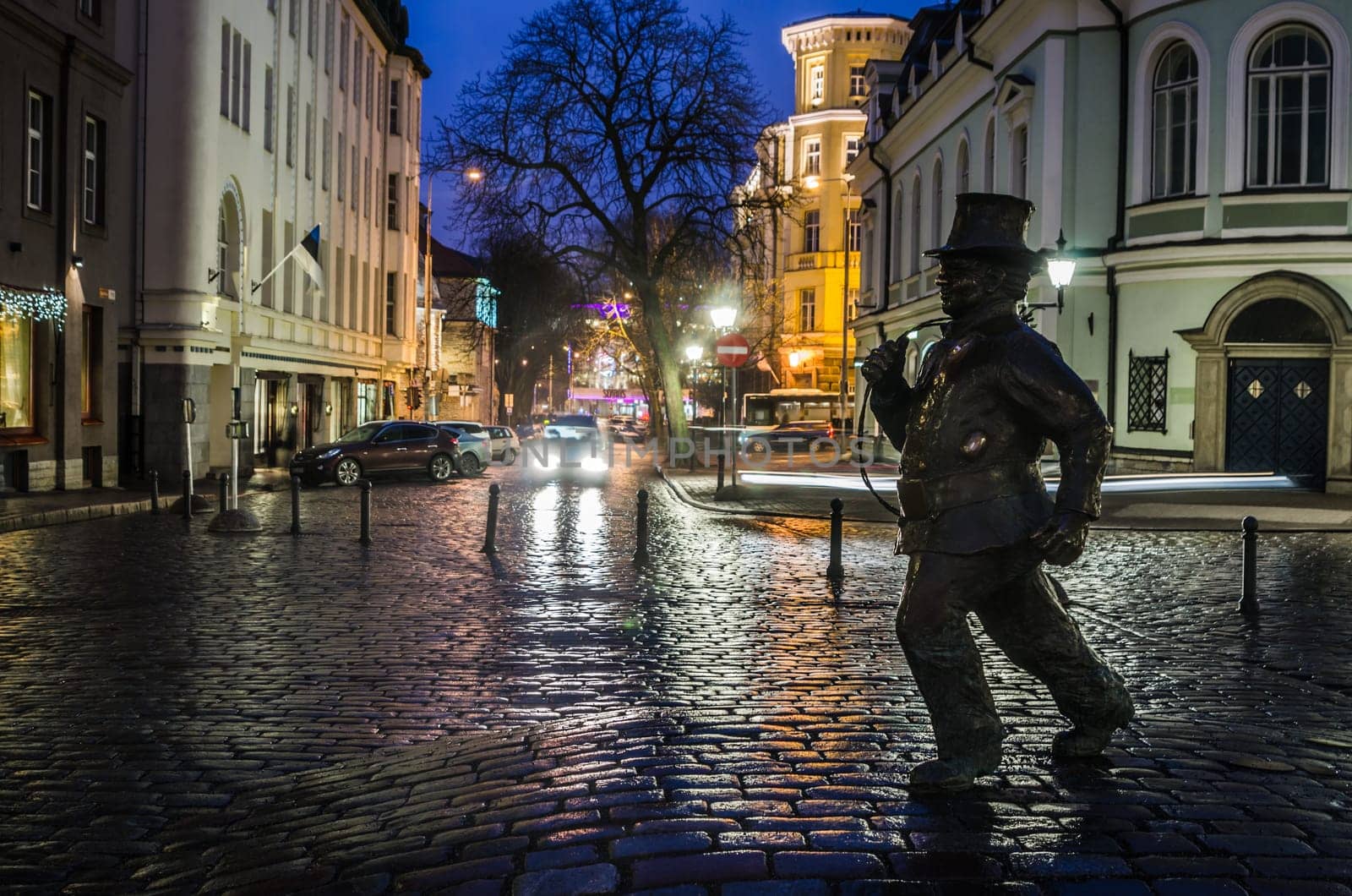 TALLINN, ESTONIA - JANUARY 29, 2017: Lucky Chimney Sweeper Sculpture. The sculpture by the Estonian sculptor Tauno Kangro was unveiled on May 15, 2010 near the cinema theater Soprus in Tallinn Old Town.