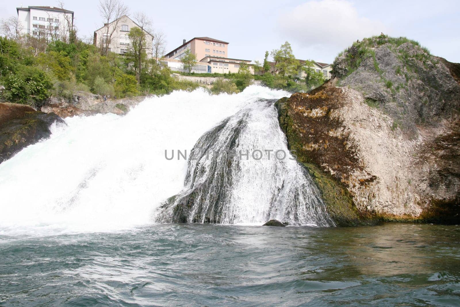 Waterfall with white,foaming spray