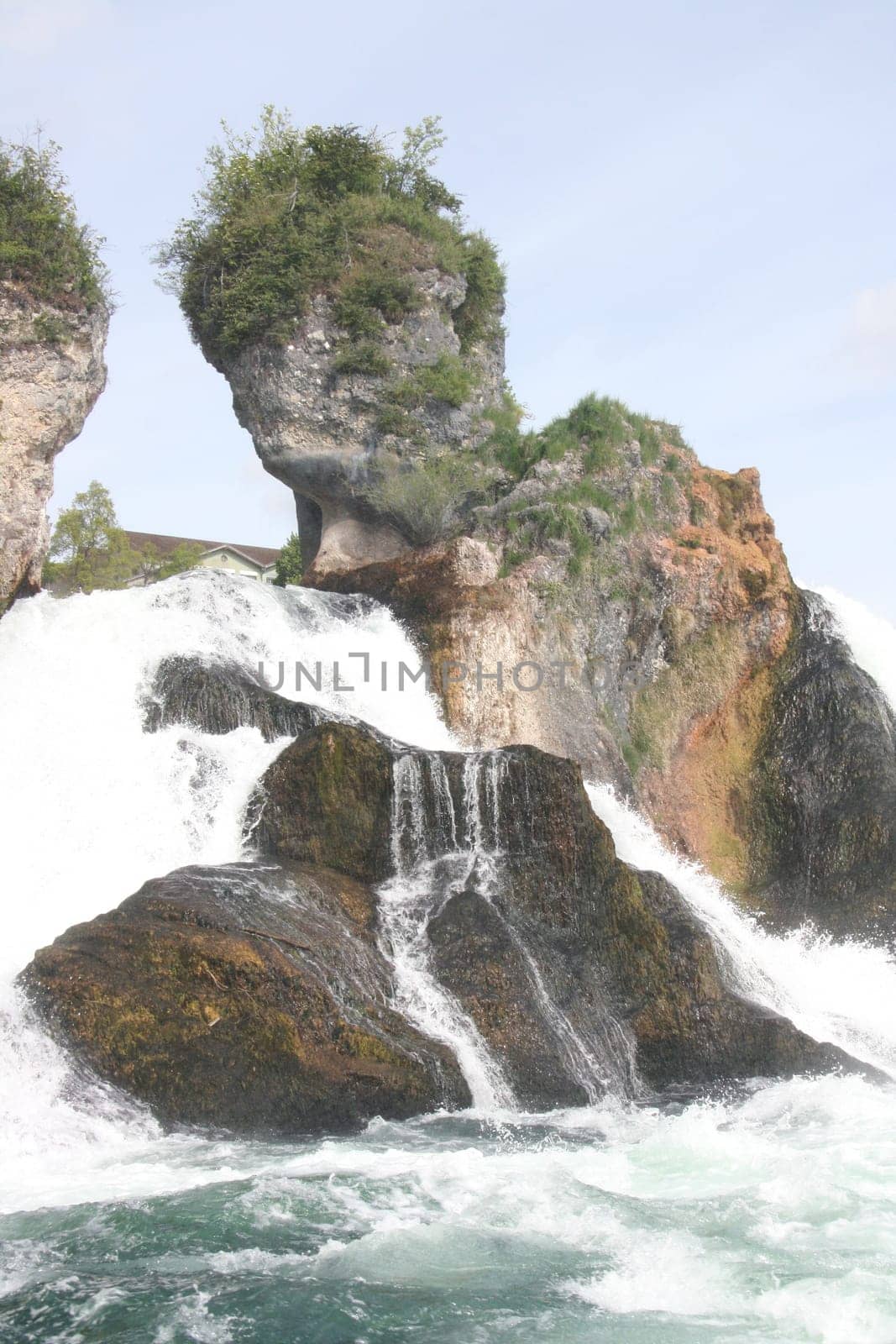 Waterfall with white,foaming spray