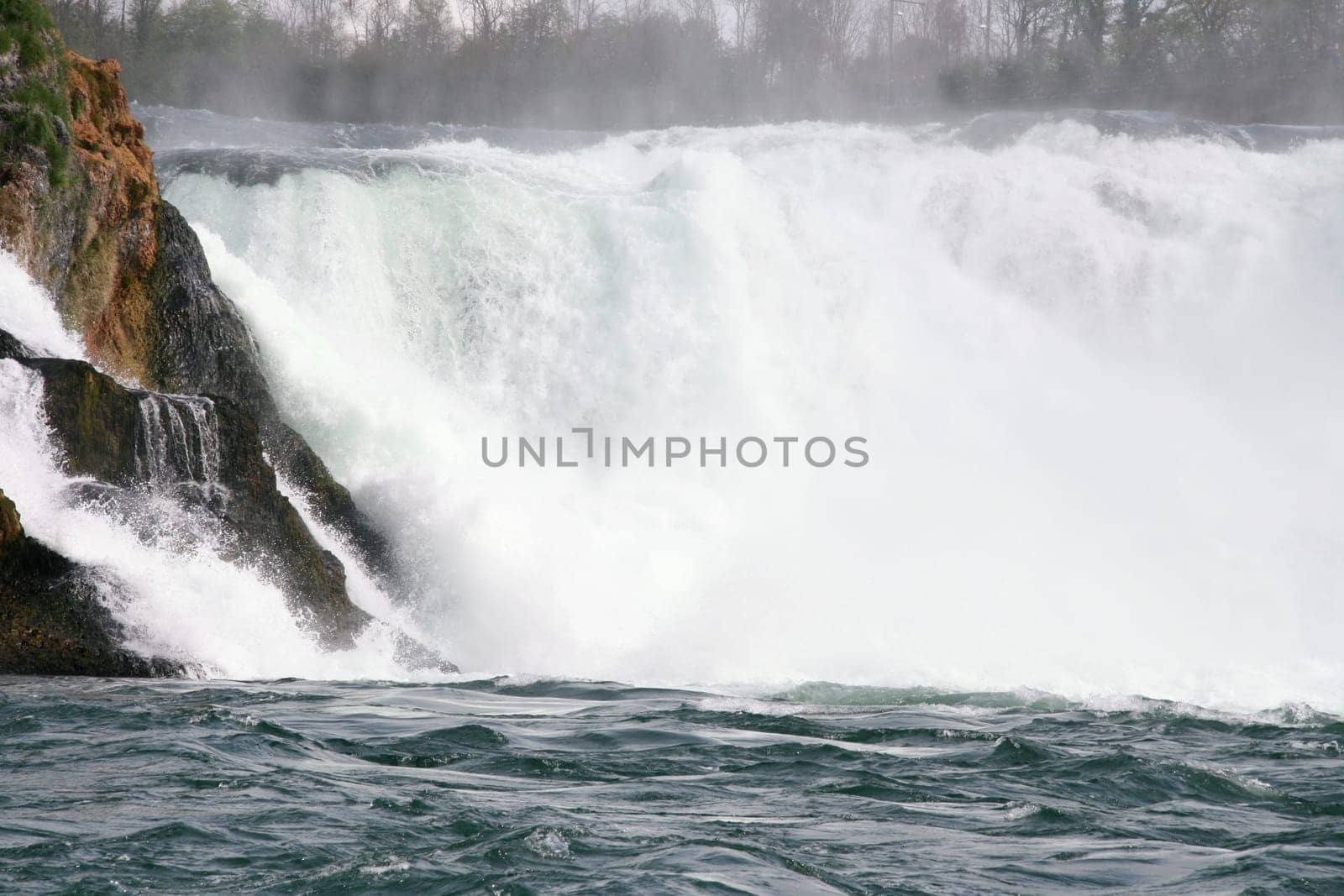Waterfall with white,foaming spray