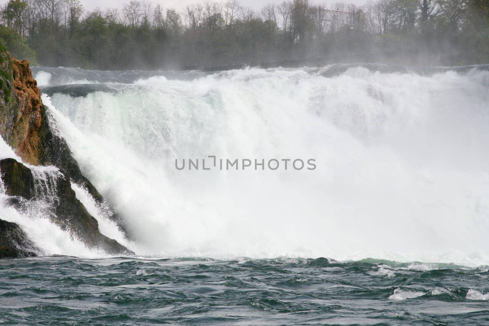 Waterfall with white,foaming spray