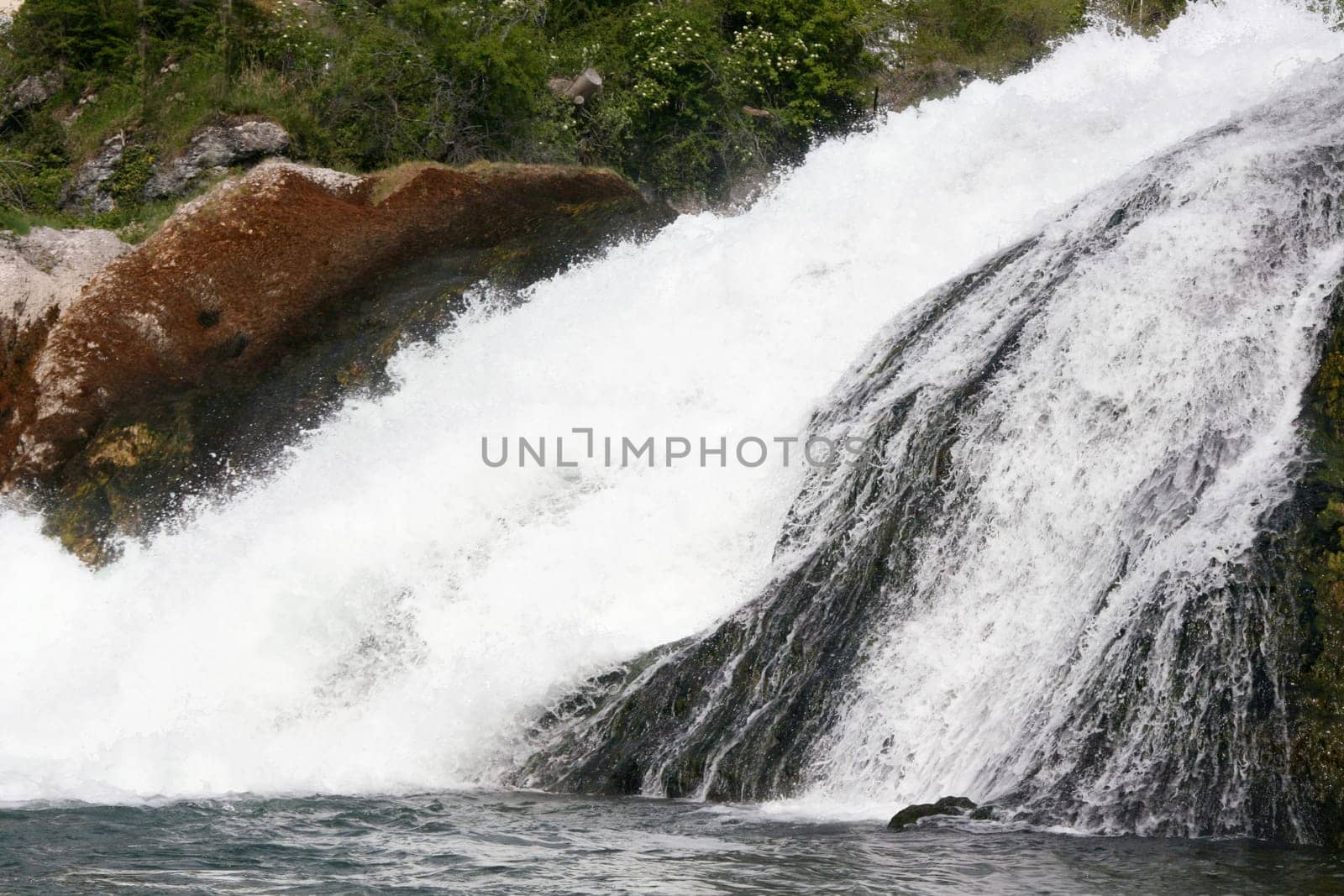 Waterfall with white,foaming spray