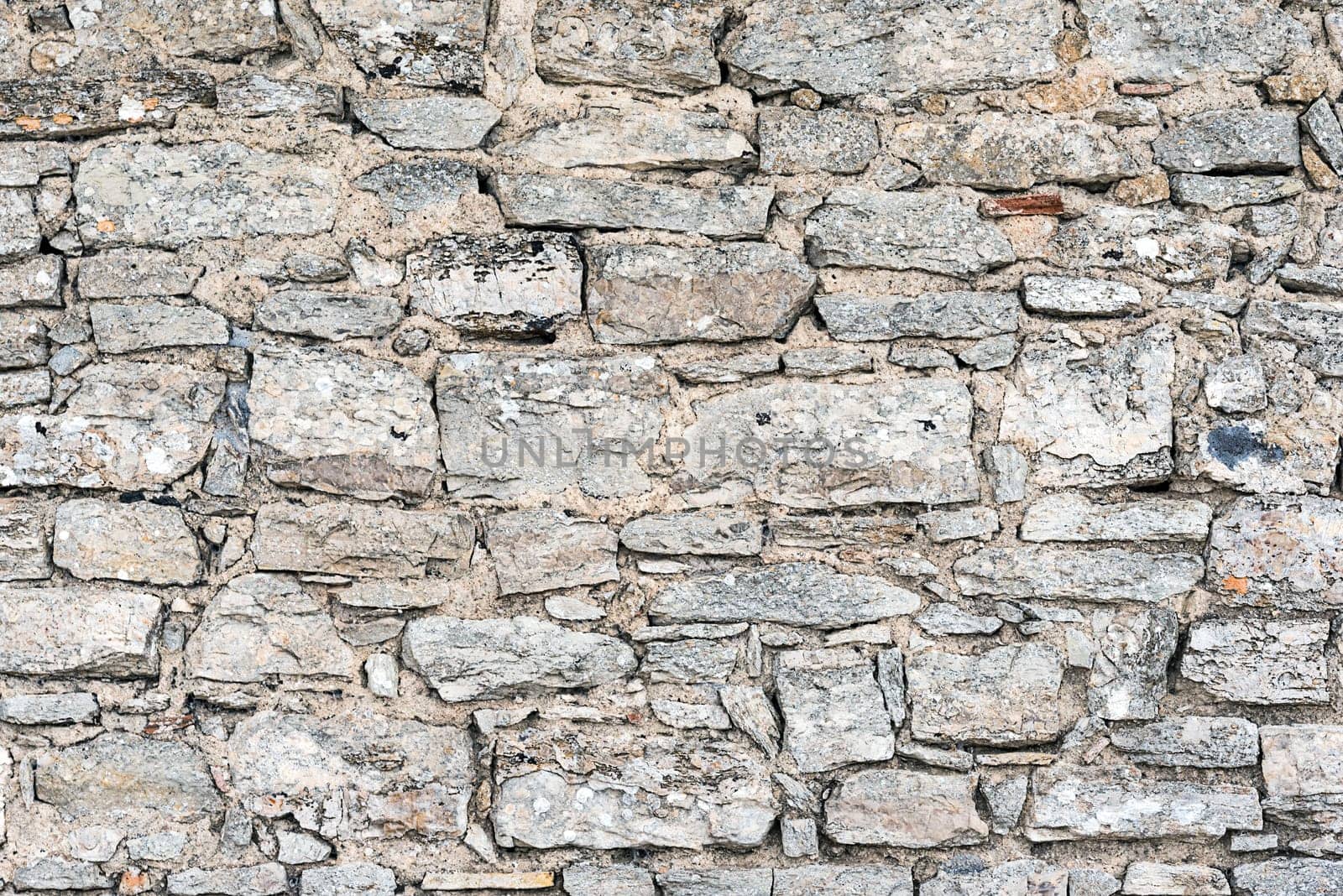 Background from an old natural stone wall wall