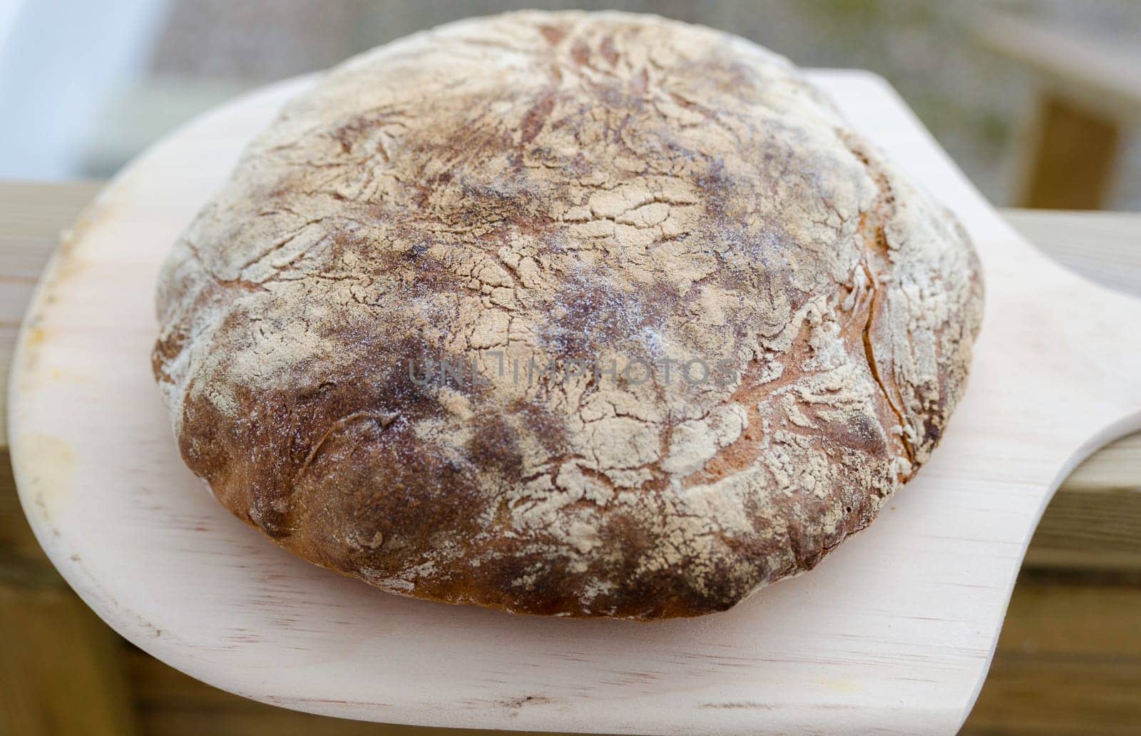 one lovely home made bread ready to eat wiht butter on
