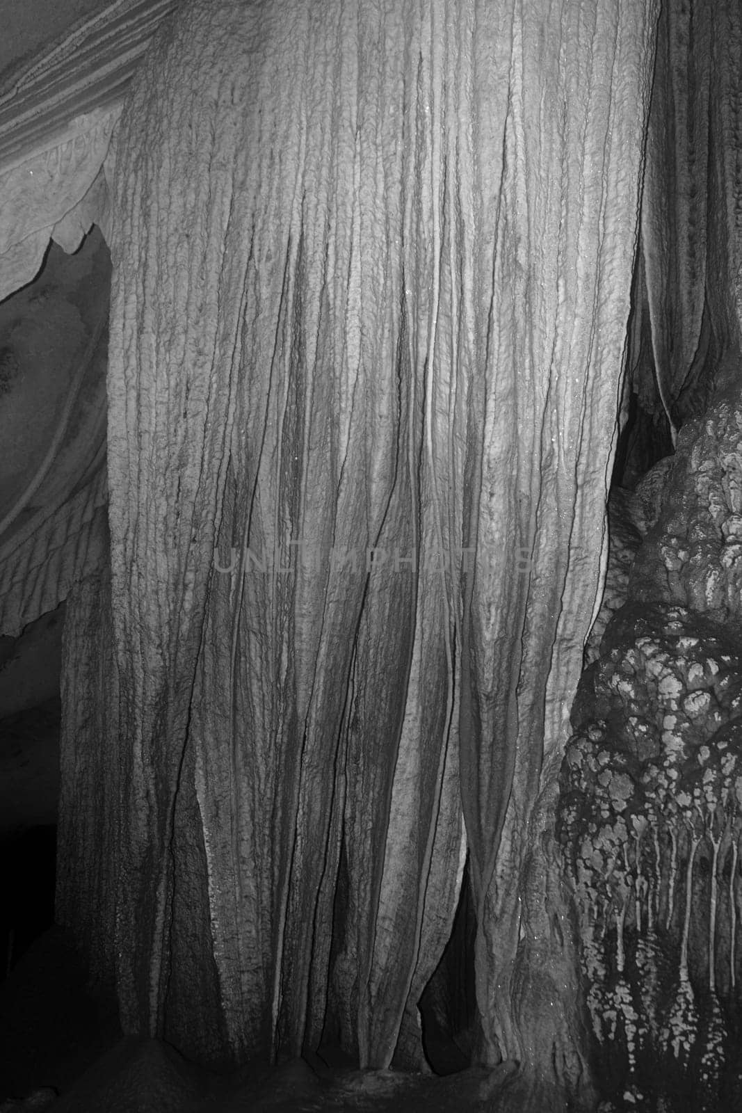 cave stalagmites formations wall black white
