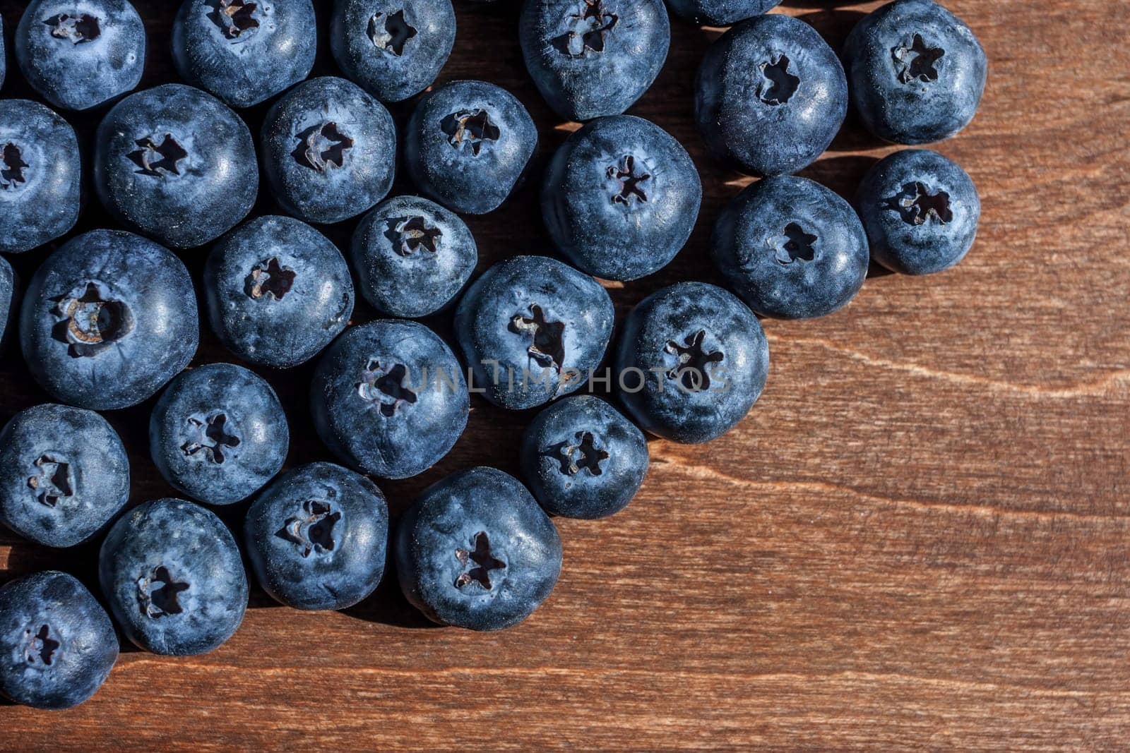 fresh big delicious blueberries wooden background free space for text