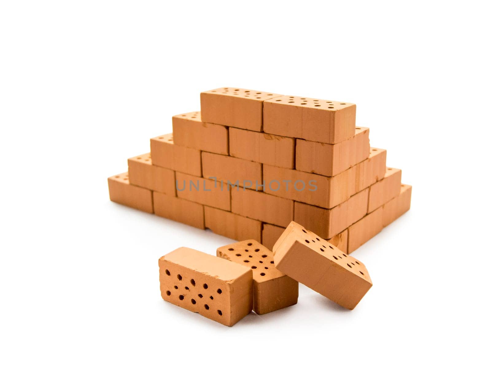 Hinted masonry of toy bricks on a white background.