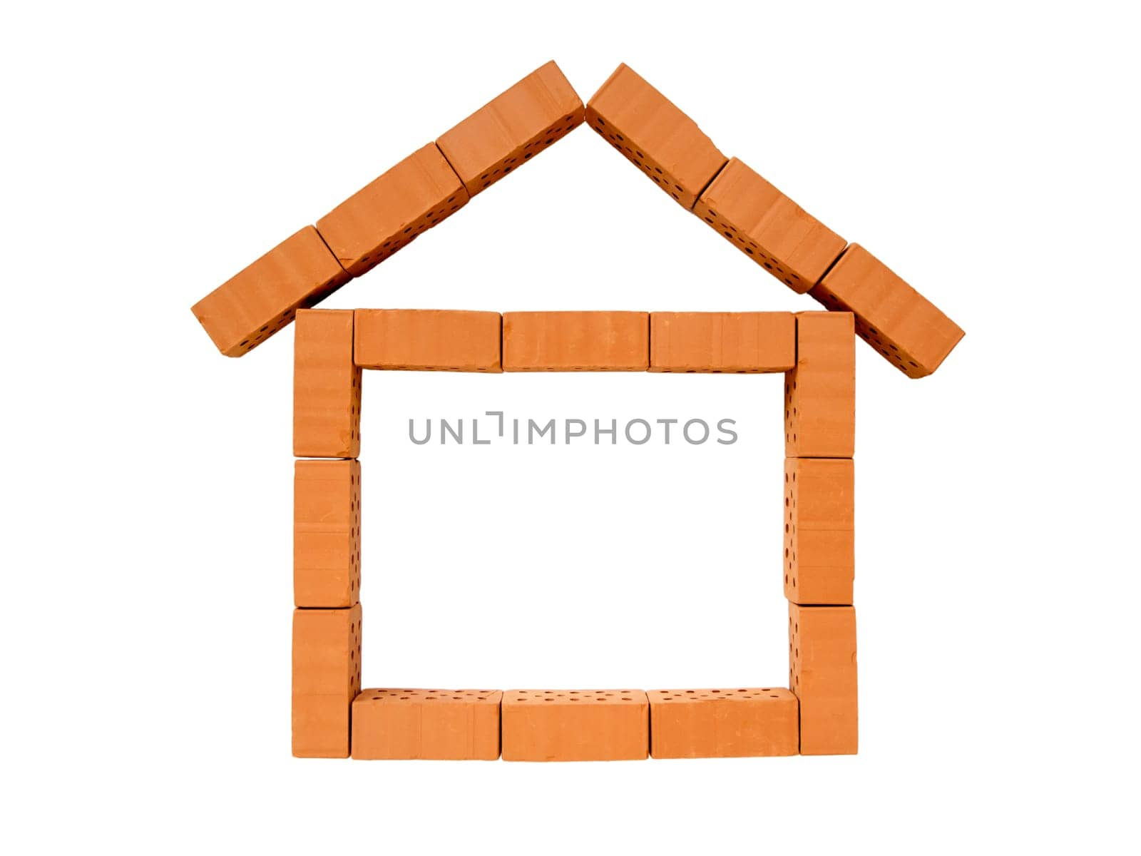 Indicated house made of toy bricks on white background