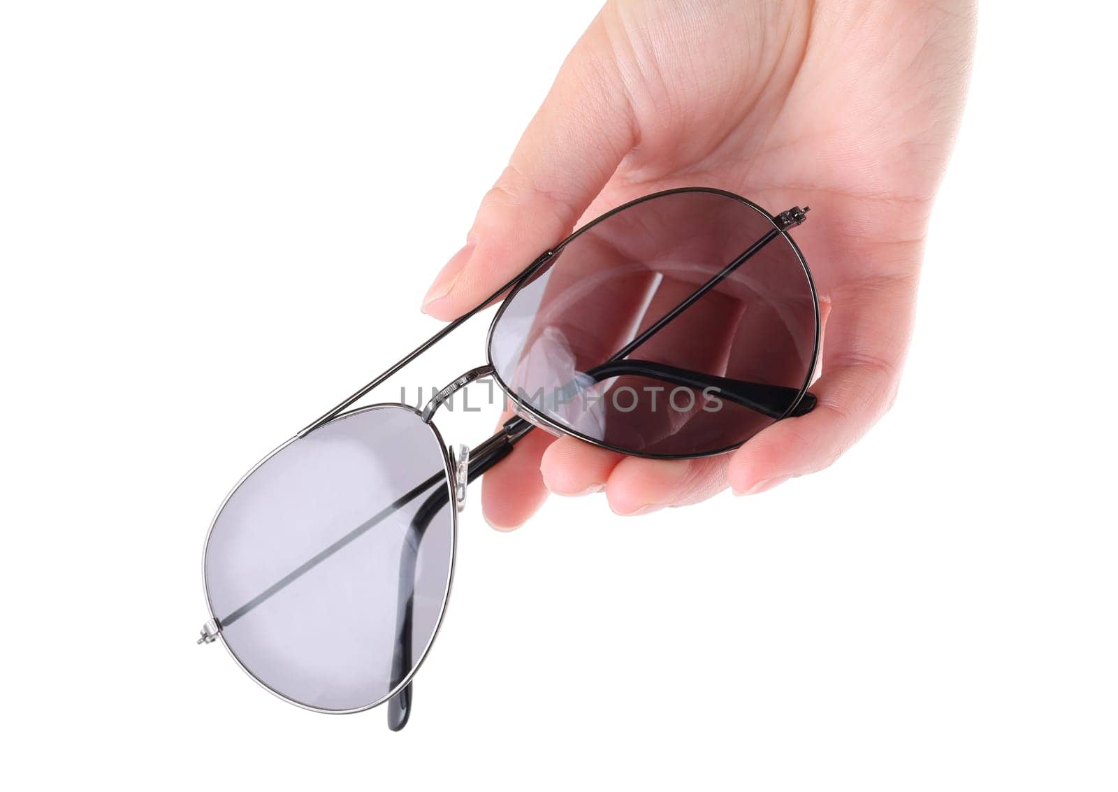 Hand holding gray sunglasses isolated on white background