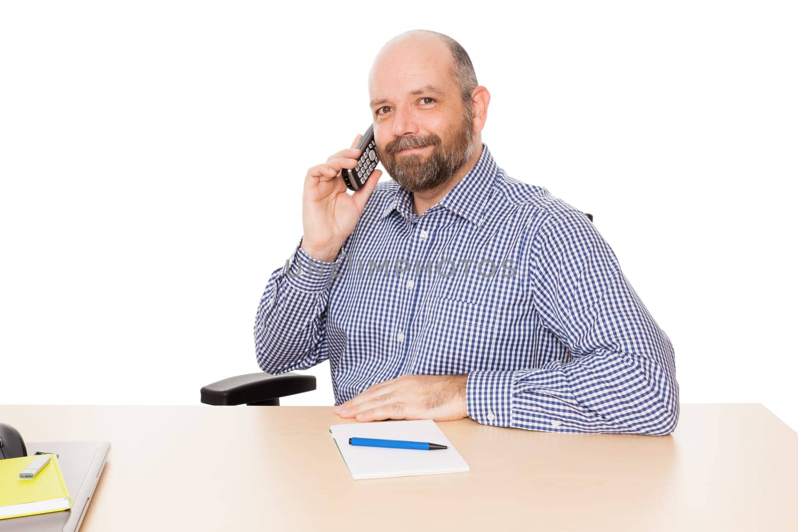 A business man on the phone against a white background