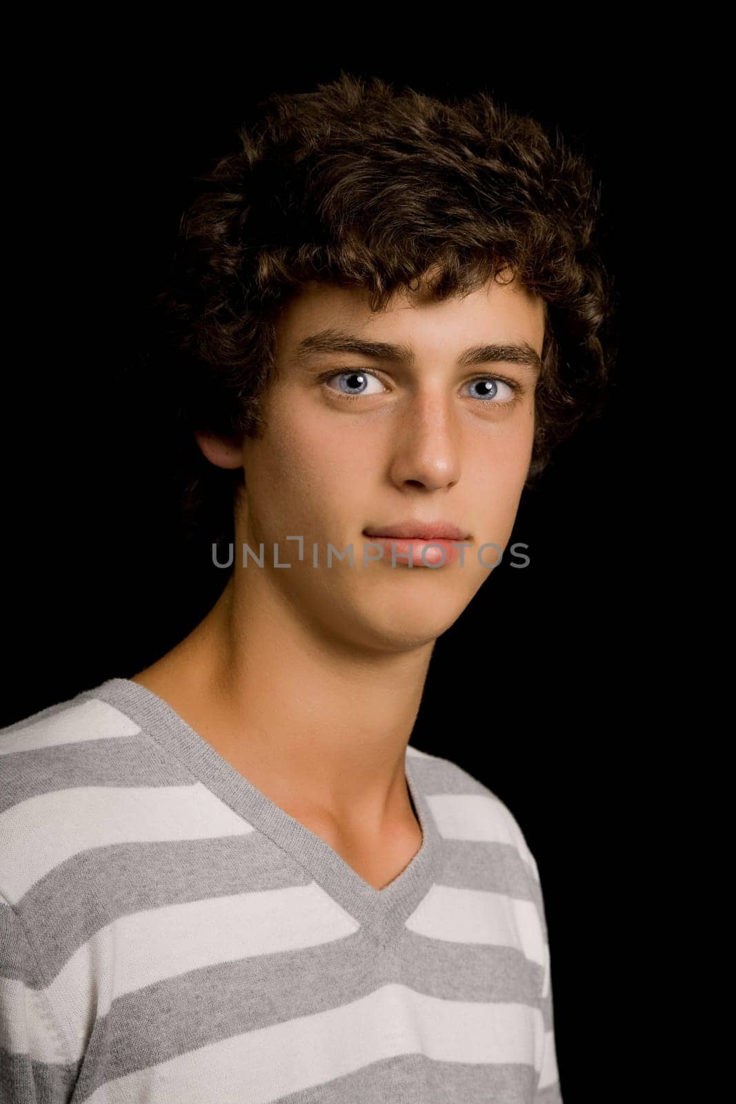 young man portrait, on a black background