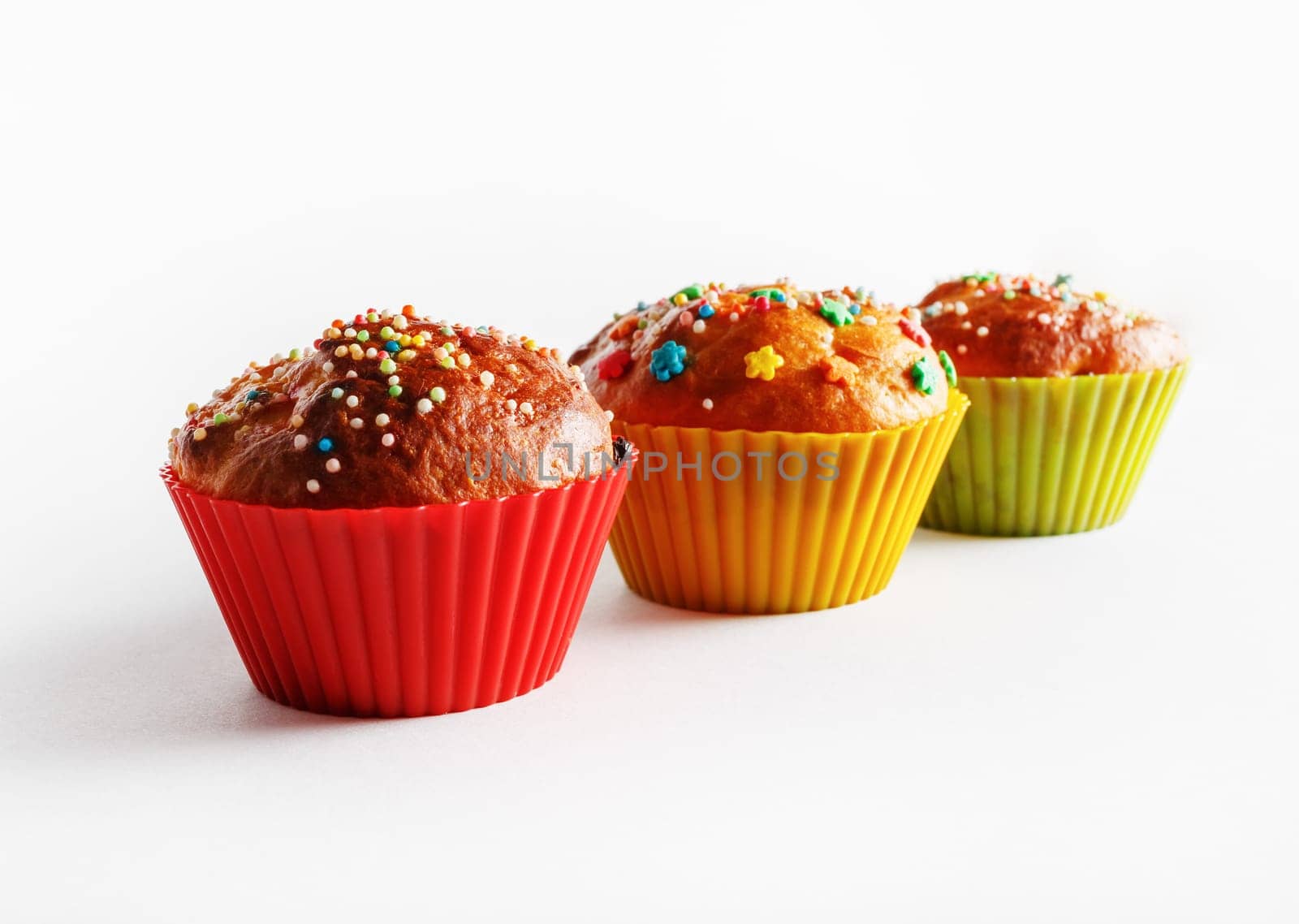 Three delicious sweet cupcakes. Tasty homemade muffins. Shallow depth of field. Selective focus.