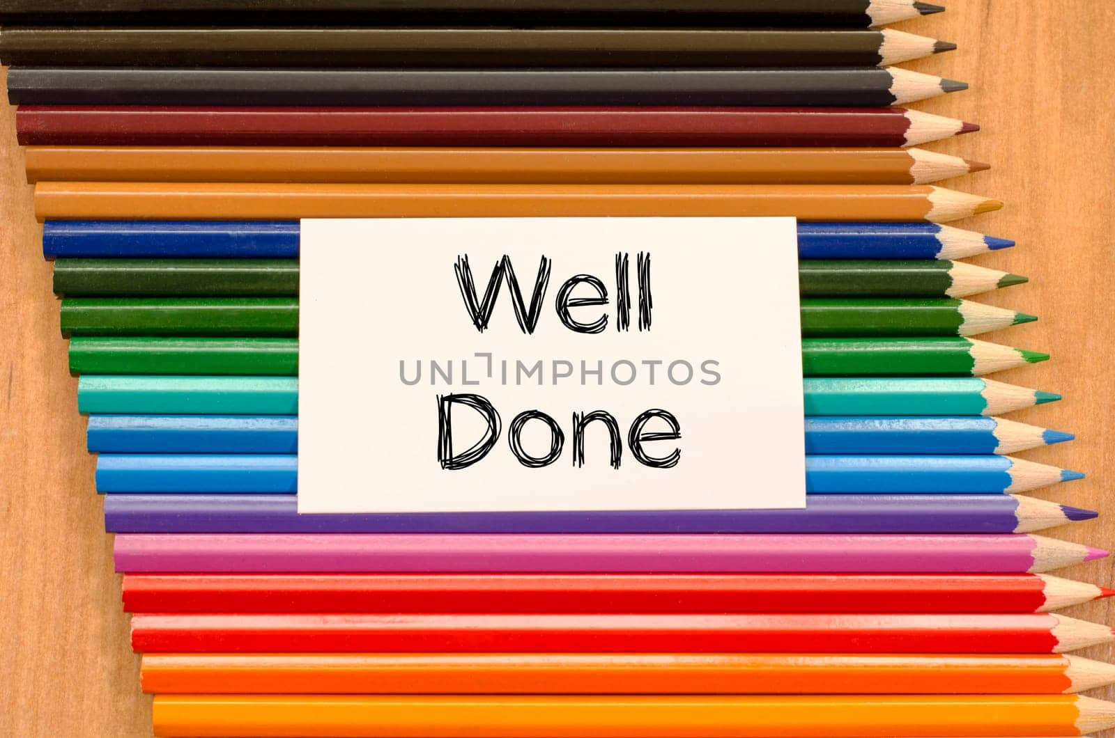 Blank white paper and colored pencil on wooden background