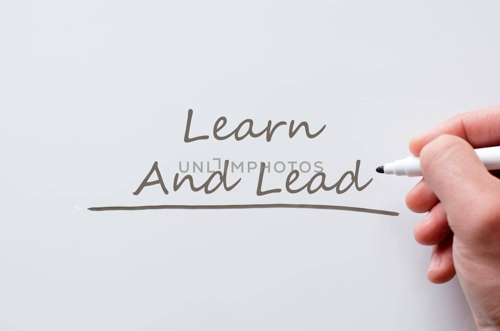 Human hand writing learn and lead on whiteboard