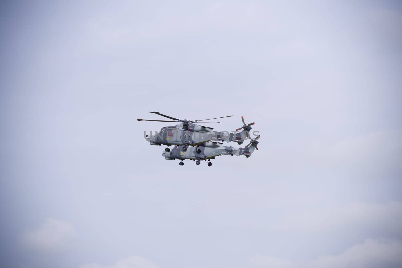 LEEUWARDEN, NETHERLANDS - JUNE 6, 2016: Two Royal Navy AgustaWestland AW159 Wildcat helicopters in action during the Royal Dutch Air Force days