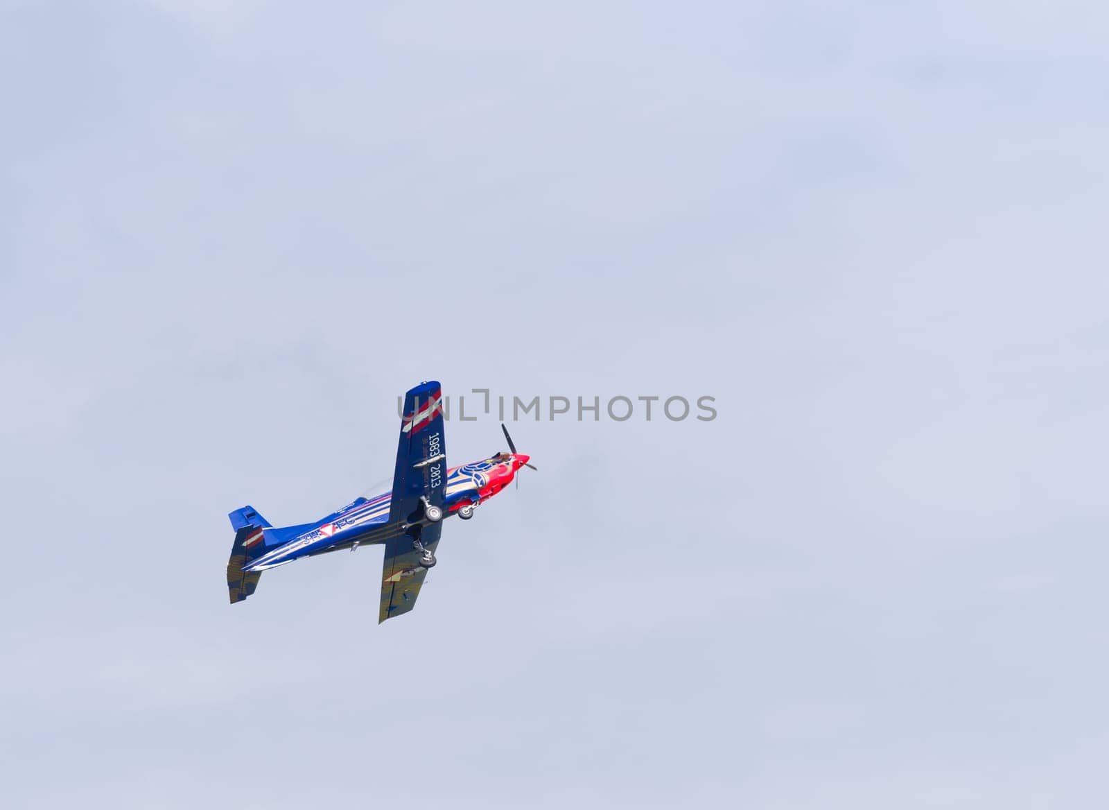 LEEUWARDEN, NETHERLANDS - JUNE 6, 2016: PC-7 Pilatus propeller plane performing a demonstration flight during the Dutch Air Force open days.