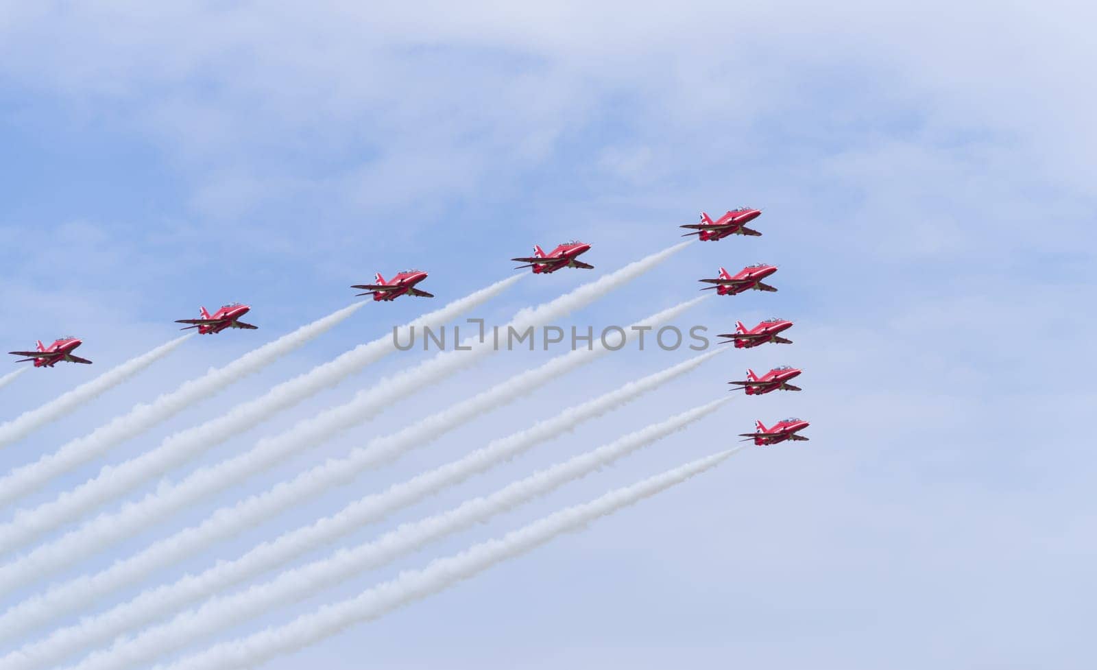 LEEUWARDEN, NETHERLANDS - JUNE 6, 2016: Famous RAF Red Arrows performing at the Dutch Air Force Open days.