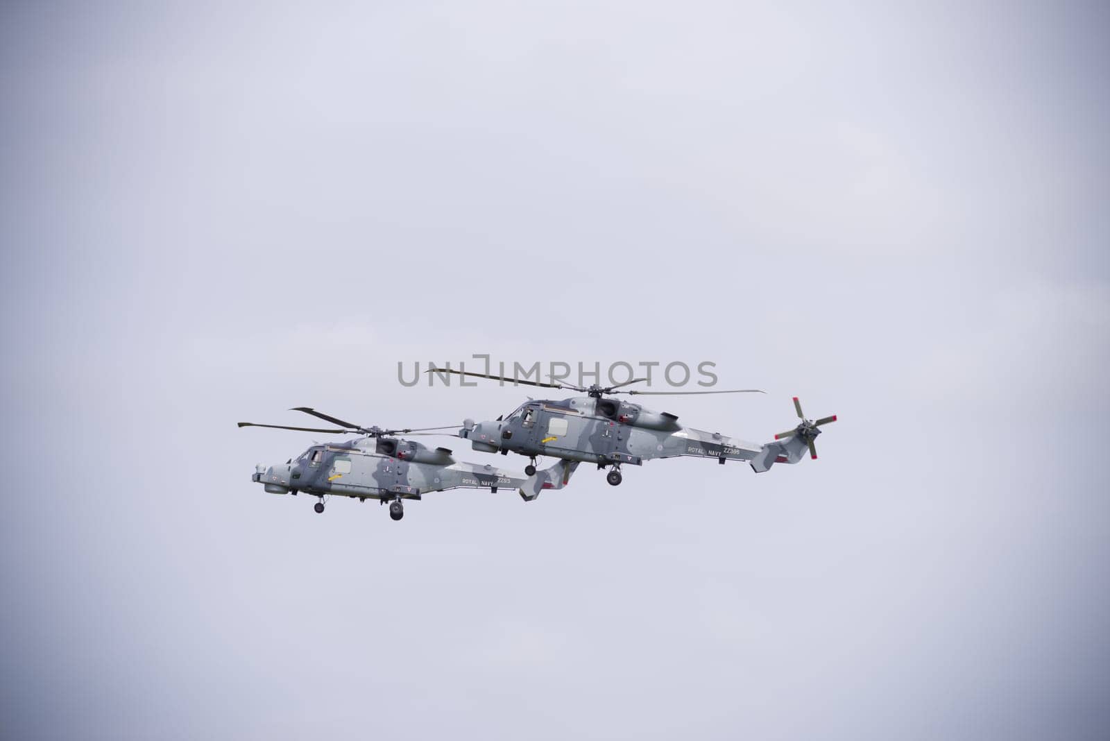 LEEUWARDEN, NETHERLANDS - JUNE 6, 2016: Two Royal Navy AgustaWestland AW159 Wildcat helicopters in action during the Royal Dutch Air Force days