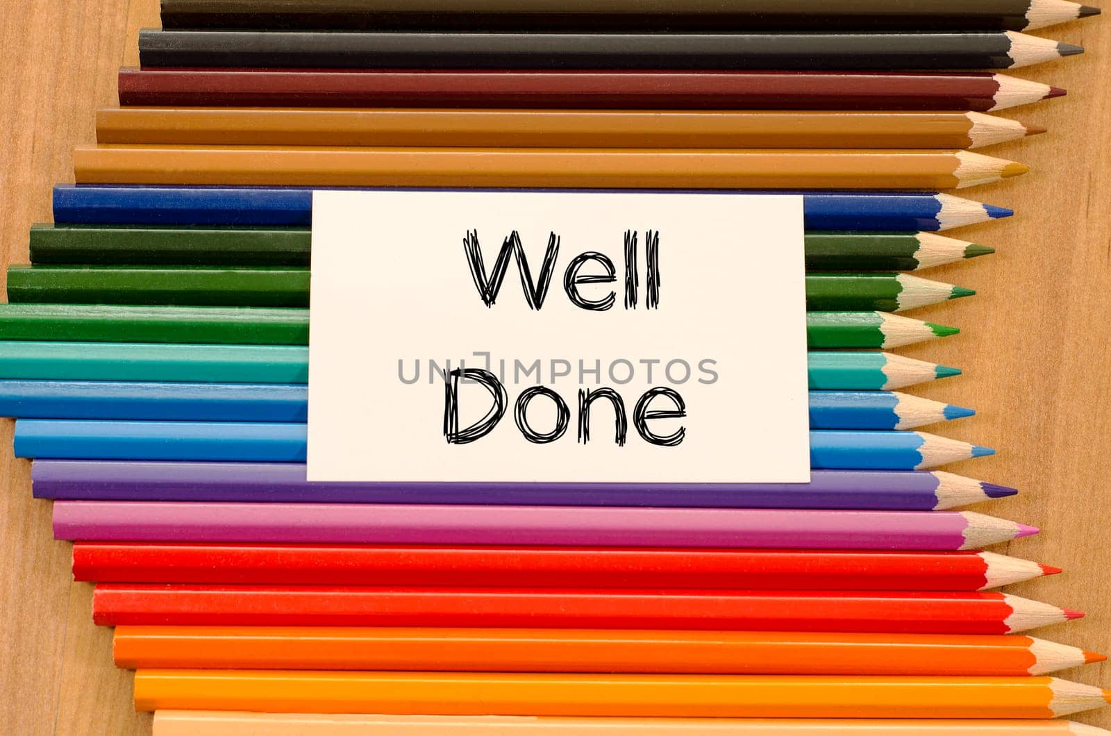 Blank white paper and colored pencil on wooden background