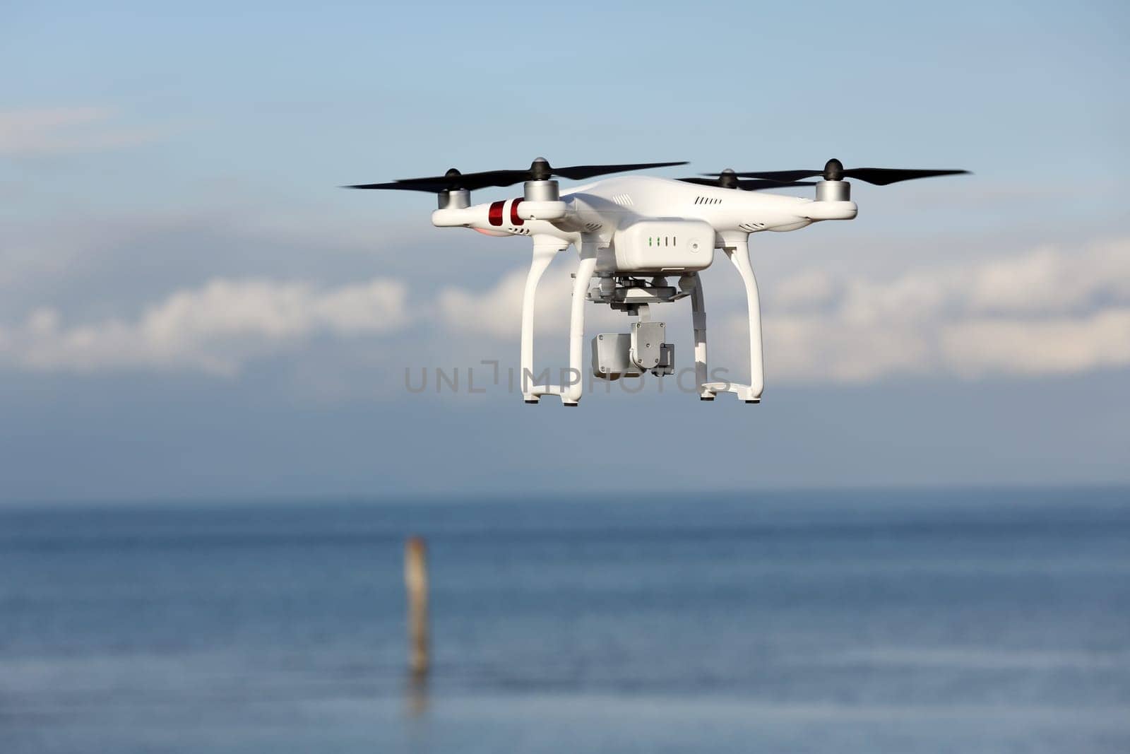Drone quad copter with flying in the blue sky