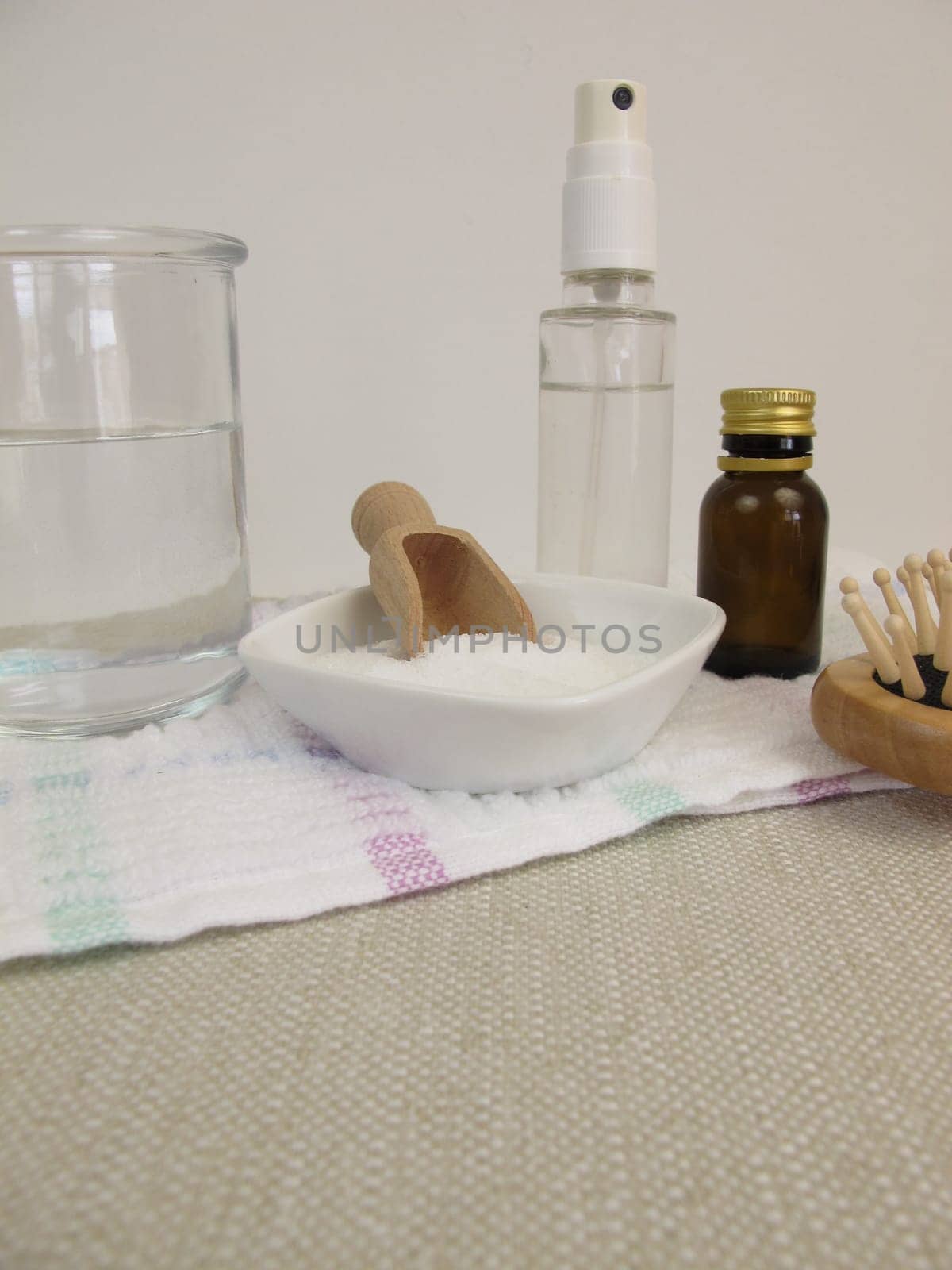 Homemade hairspray made from sugar water and essential oil