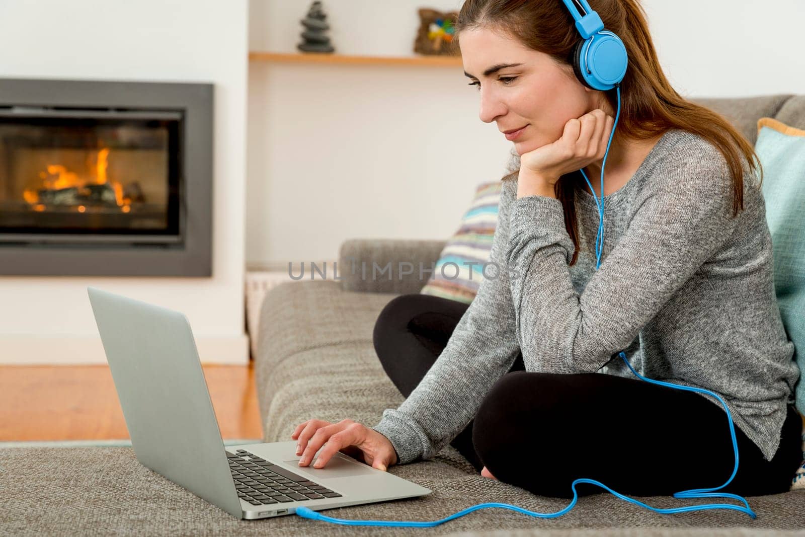 Beautiful woman at home and listen music